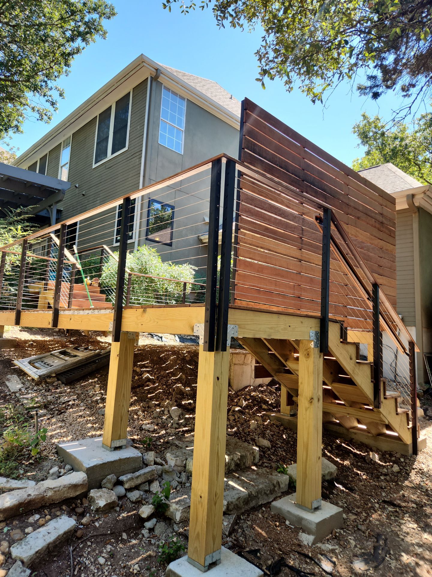 Austin Custom Deck Replacement with Cable Railings and Privacy Walls by RejuveNate Renovations LLC