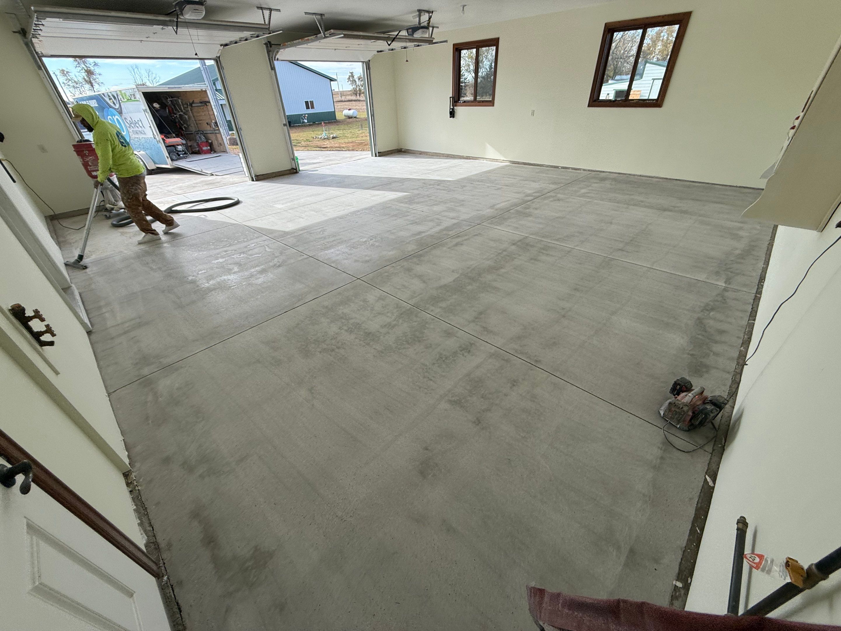 Speckled Epoxy Garage Floor Coating and Concrete Repair in Lennox by Select Painting, Coatings & Garage Cabinets