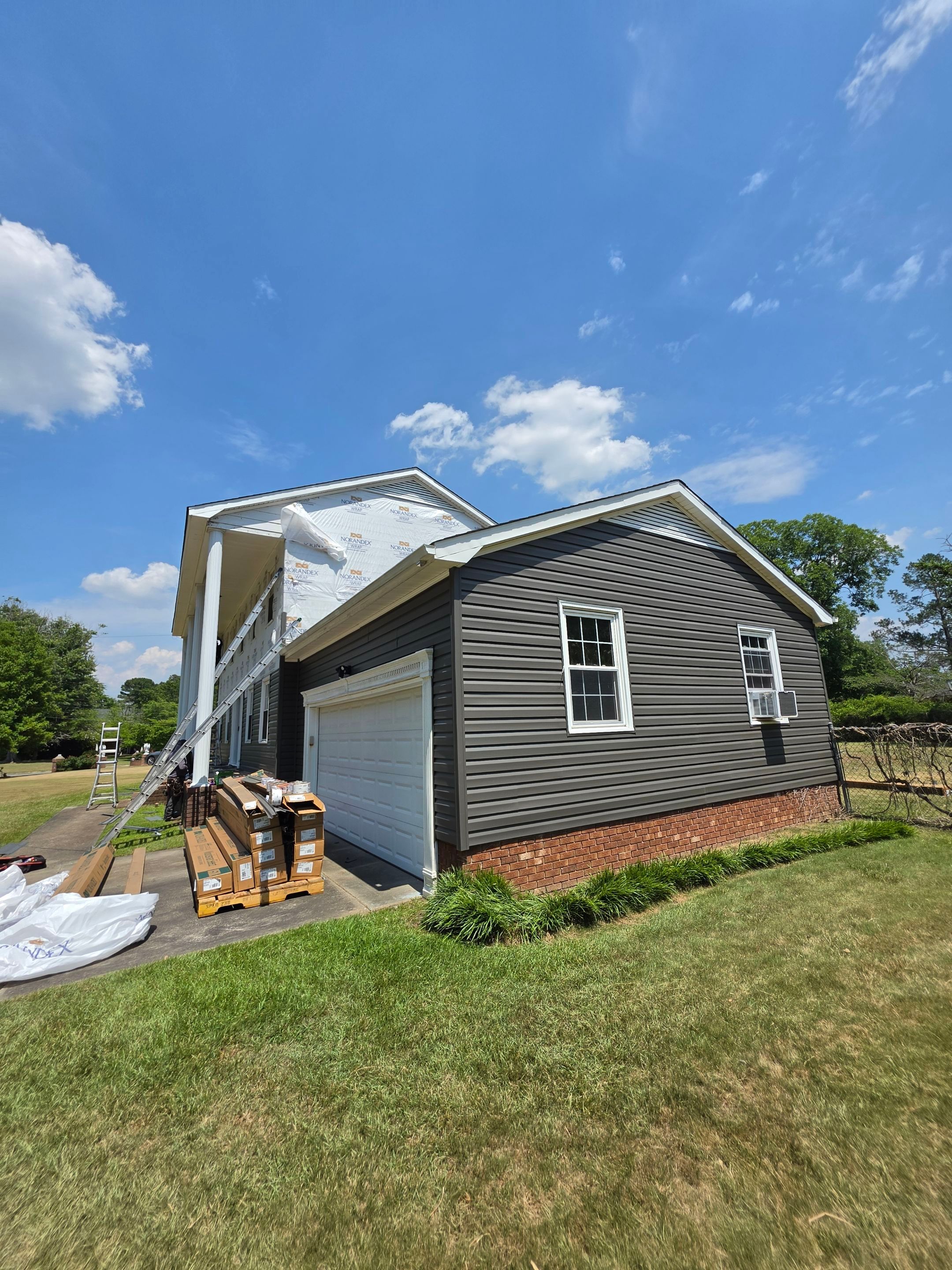 Dark Gray Siding and Custom Deck Installation in Kinston by The Remodeling Company