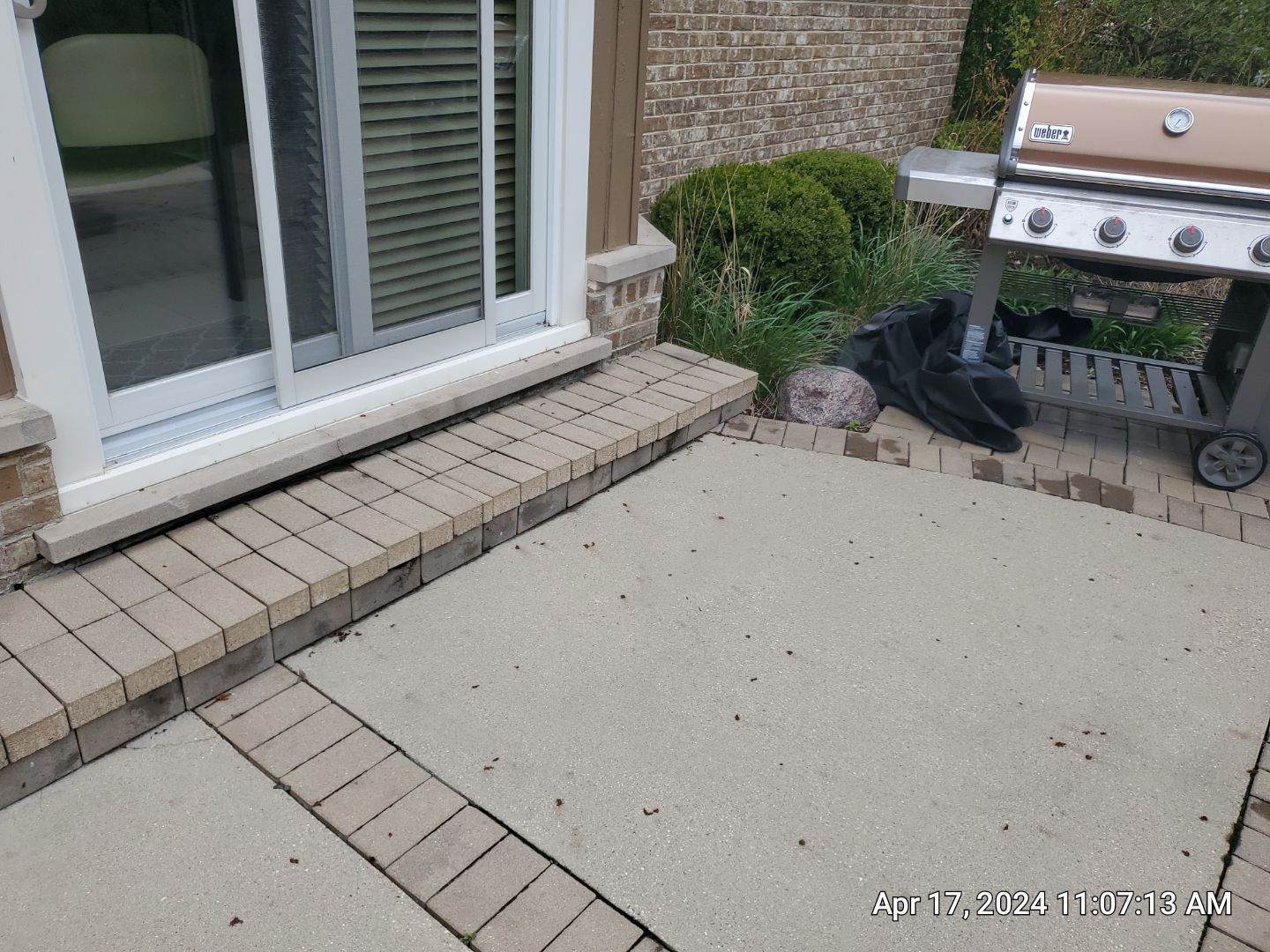 concrete patio and driveway cleaning by Northern Power Washing LLC.