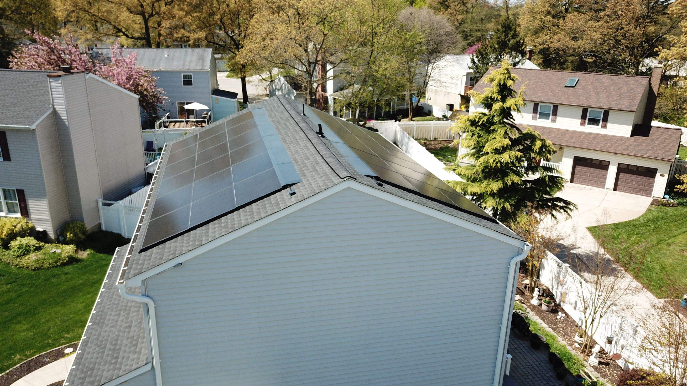 Roof Replacement with GAF Decotech integrated solar panels by American Home Contractors