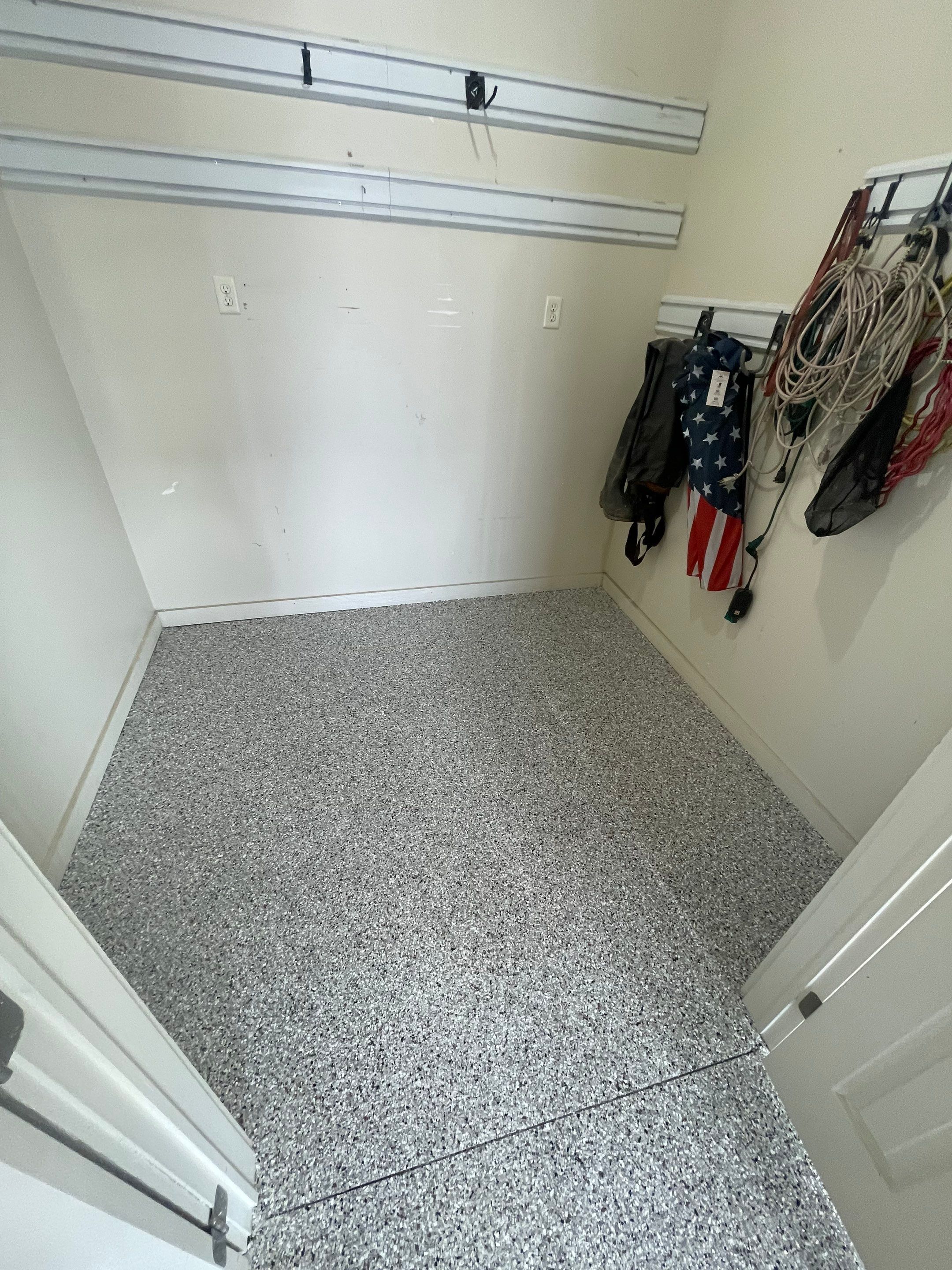 Coyote Flake Garage Floor Coating in Sioux Falls with Trench Drain by Select Painting, Coatings & Garage Cabinets