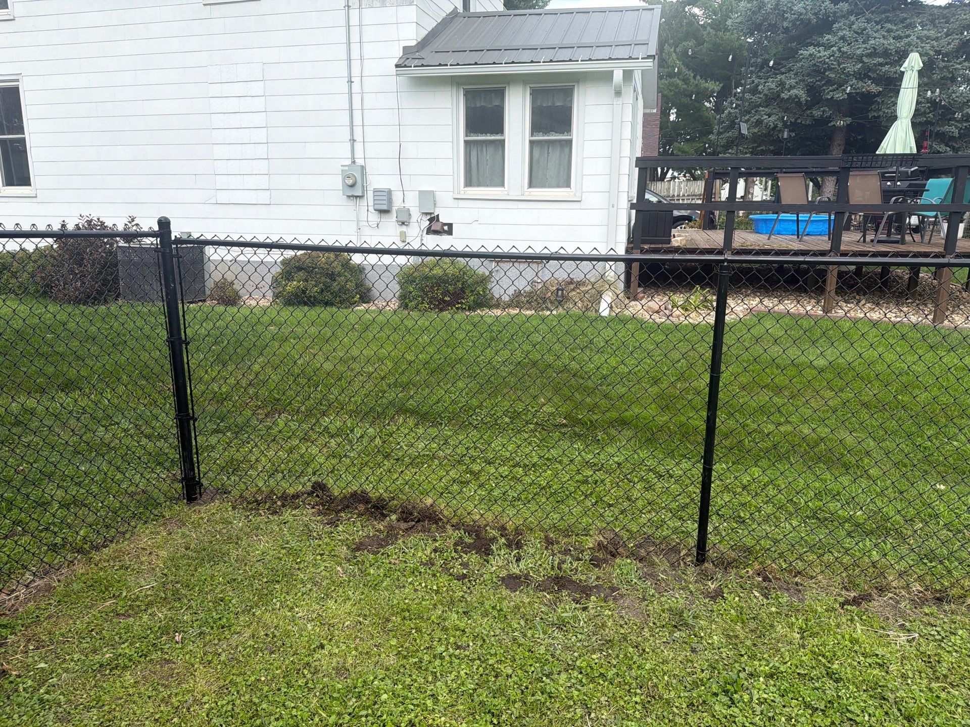 Residential Black Chain Link Fence Installation in Reinbeck by Perfect Picket Fence and Stain