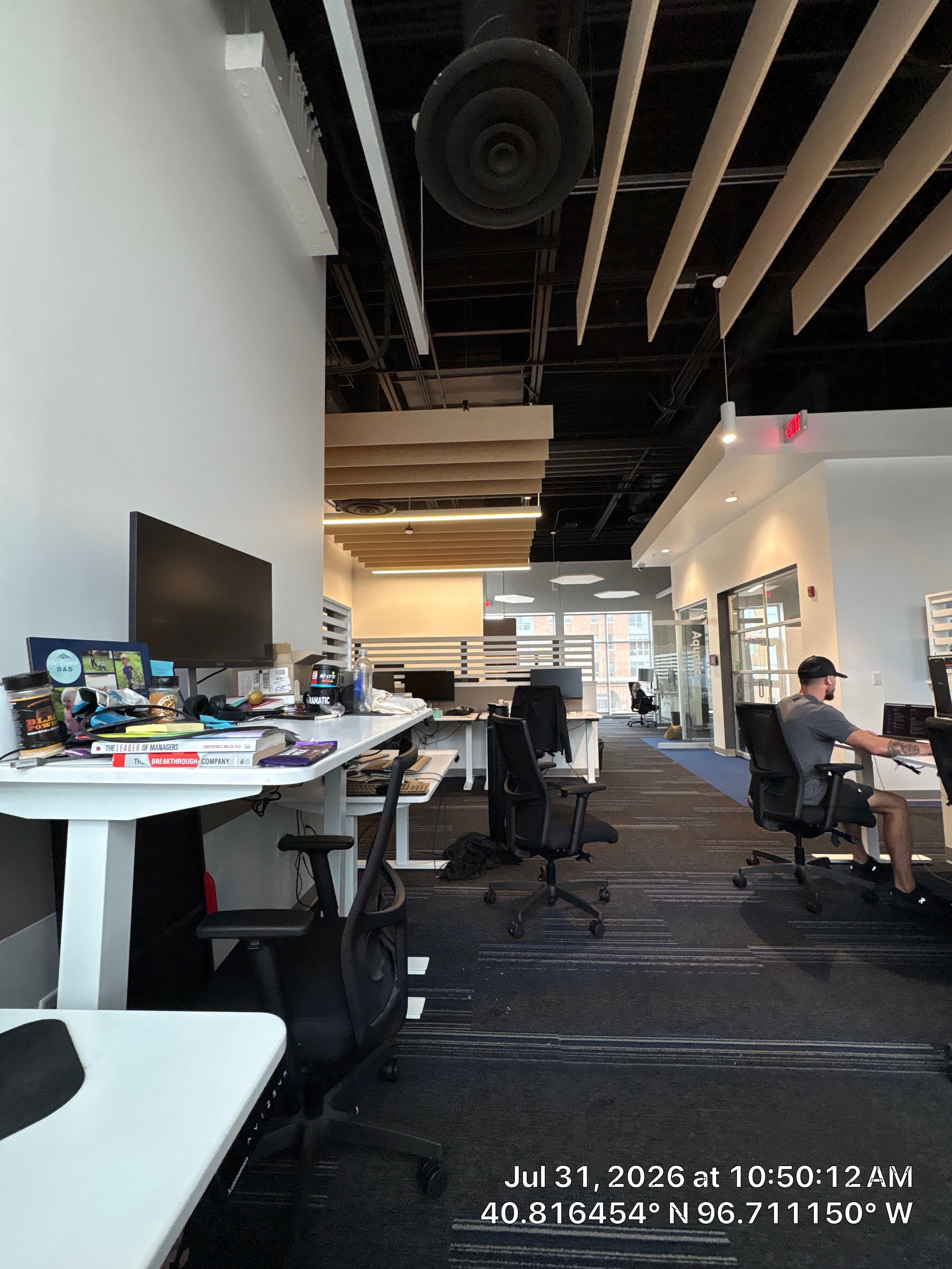 Modern Open-Plan Office Remodel with Acoustic Ceiling Baffles by CompanyCam Sales Demo
