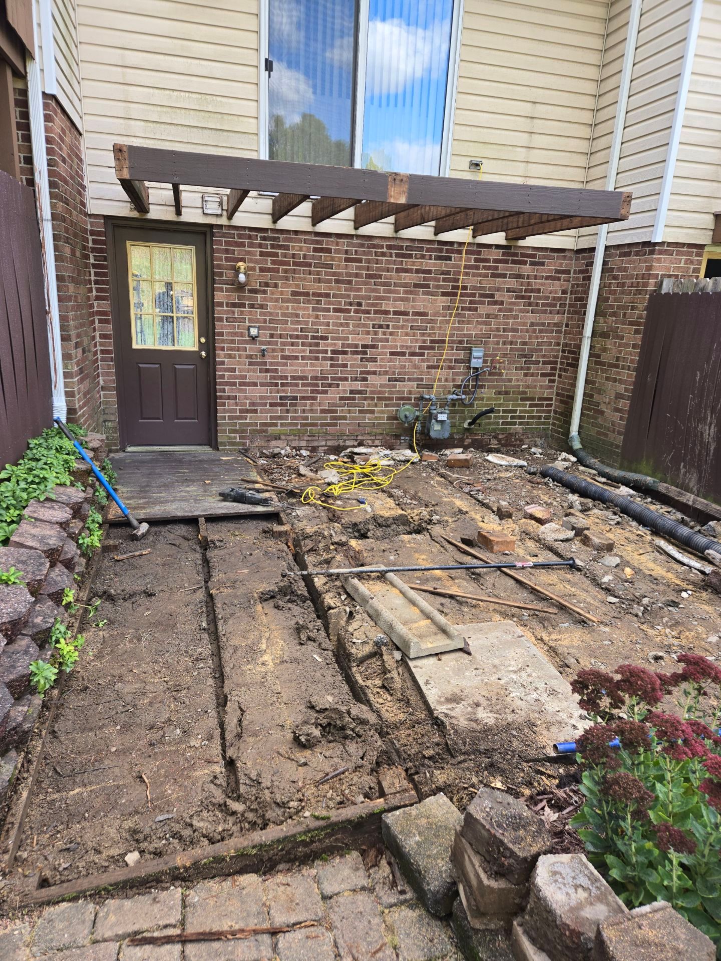 Stamped concrete and redeck  by Cousins Roofing Siding & Decks