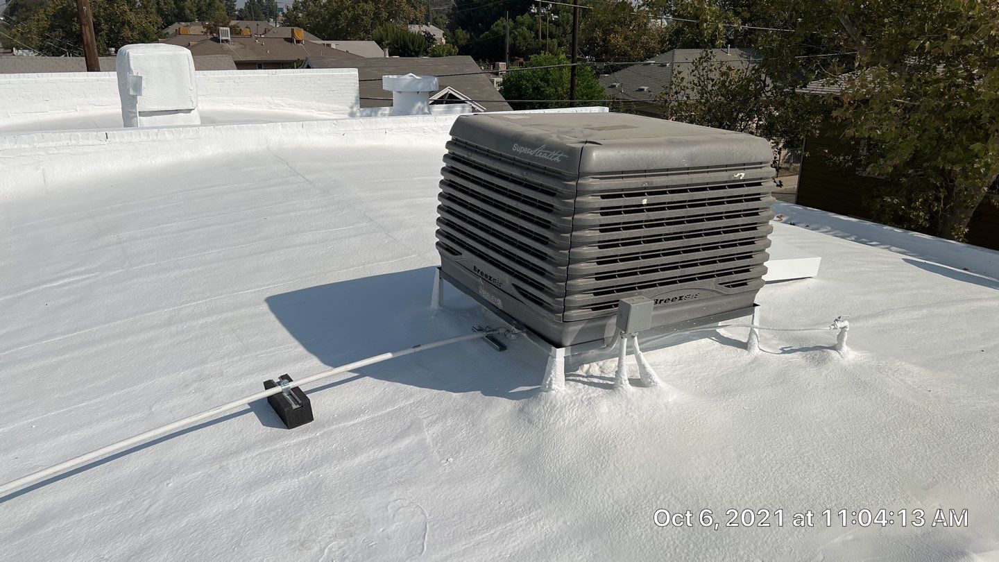 Polyurethane foam roof refurbish and recoating by Straight Edge Roofing Inc