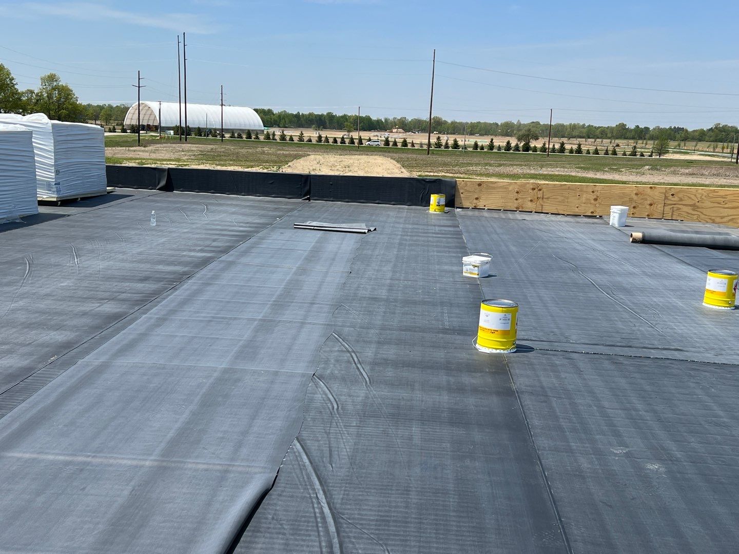 Commercial Roofing Installation using 60 mil rubber roof  by Nitro Roofing and Construction