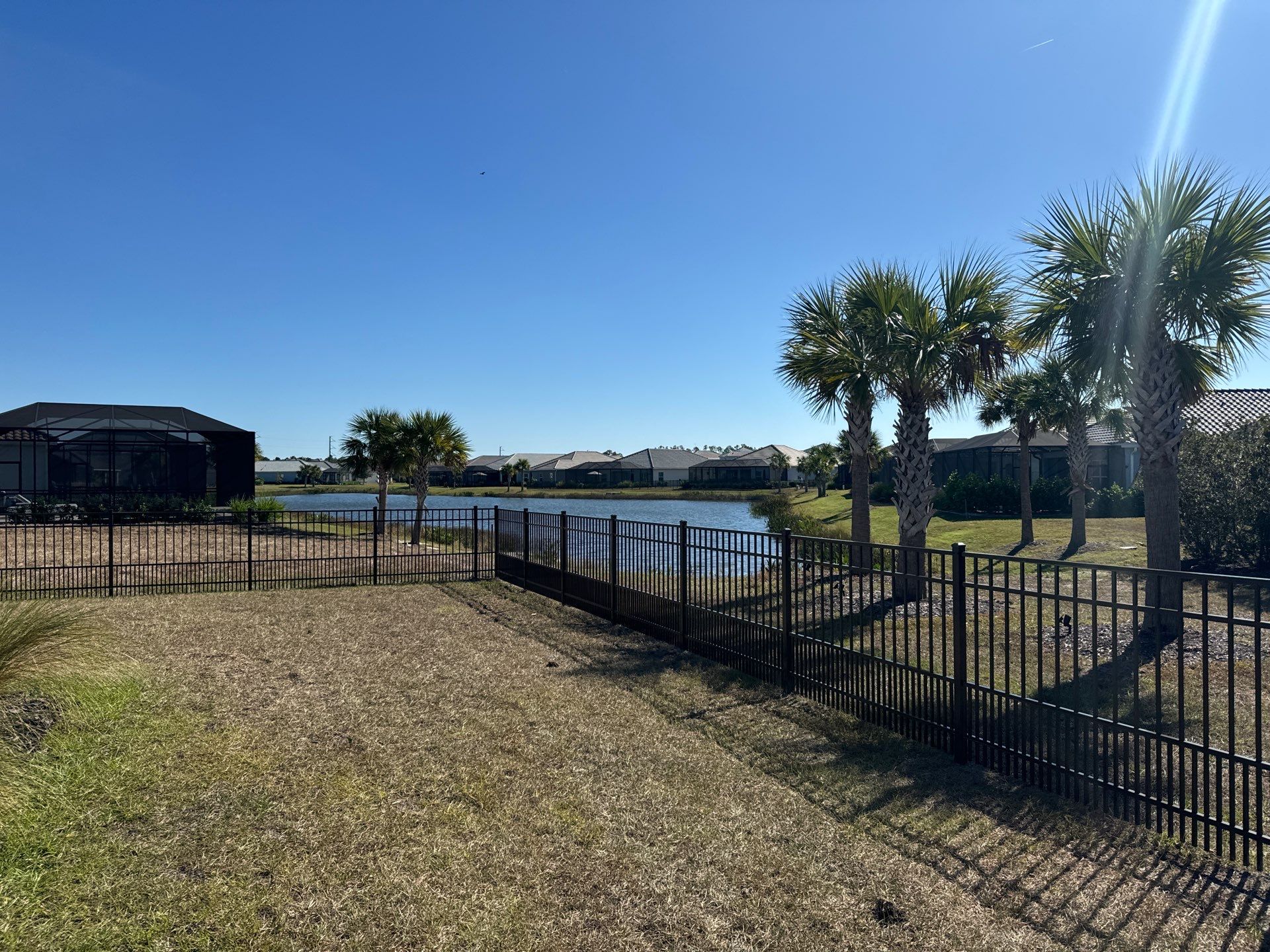 Aluminum Fence Installation using 4Ft 3 Rail Bronze Puppy Picket Aluminum Fence by Asap fence and gates, LLC