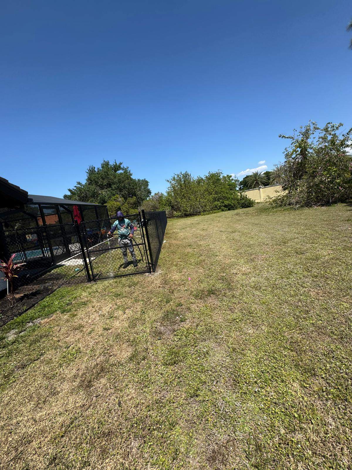 Black Chain Link Residential Backyard Fence Installation in North Port by True Fence LLC