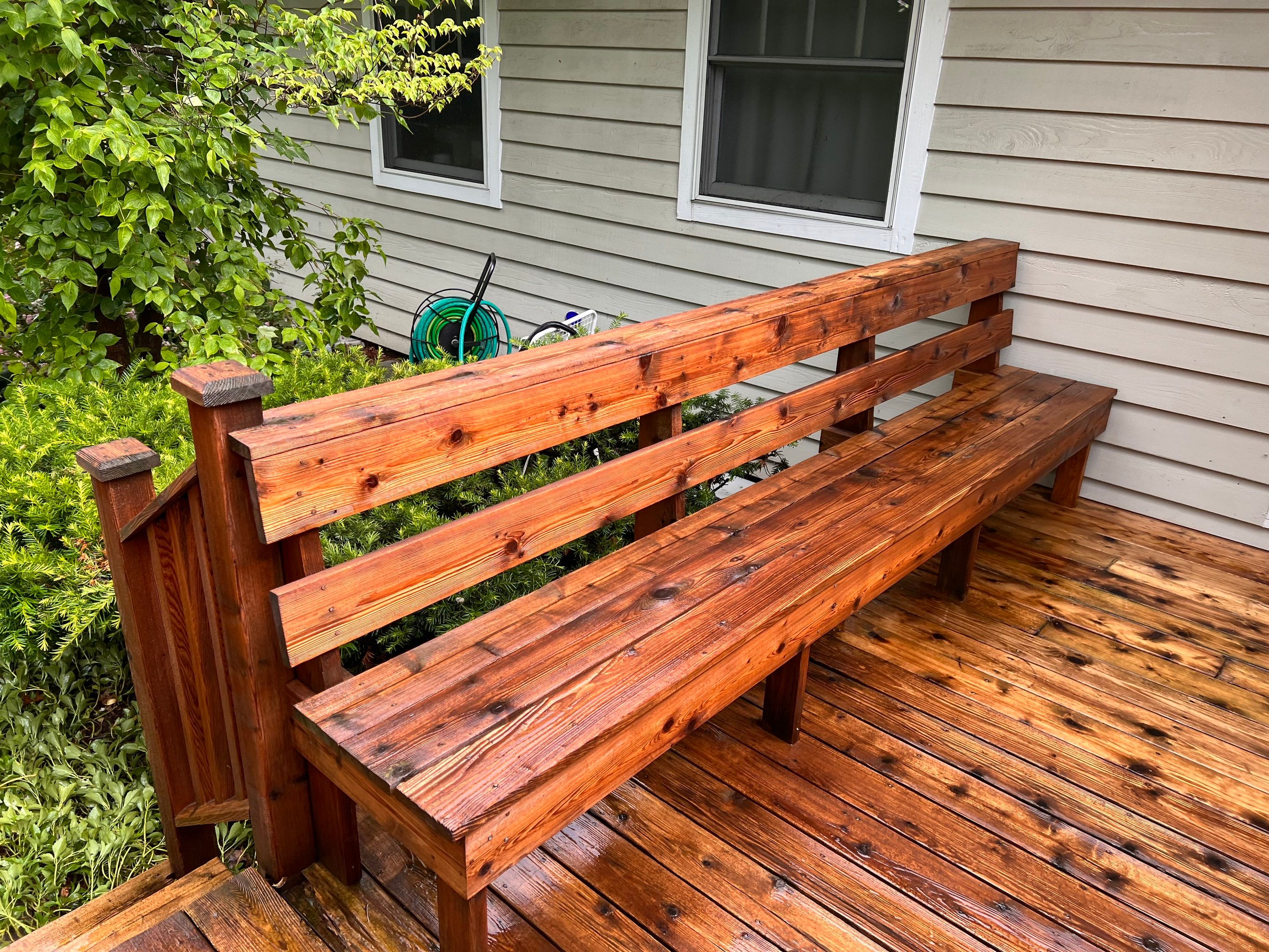 Wood deck cleaning, board replacement and staining by Northern Power Washing LLC.