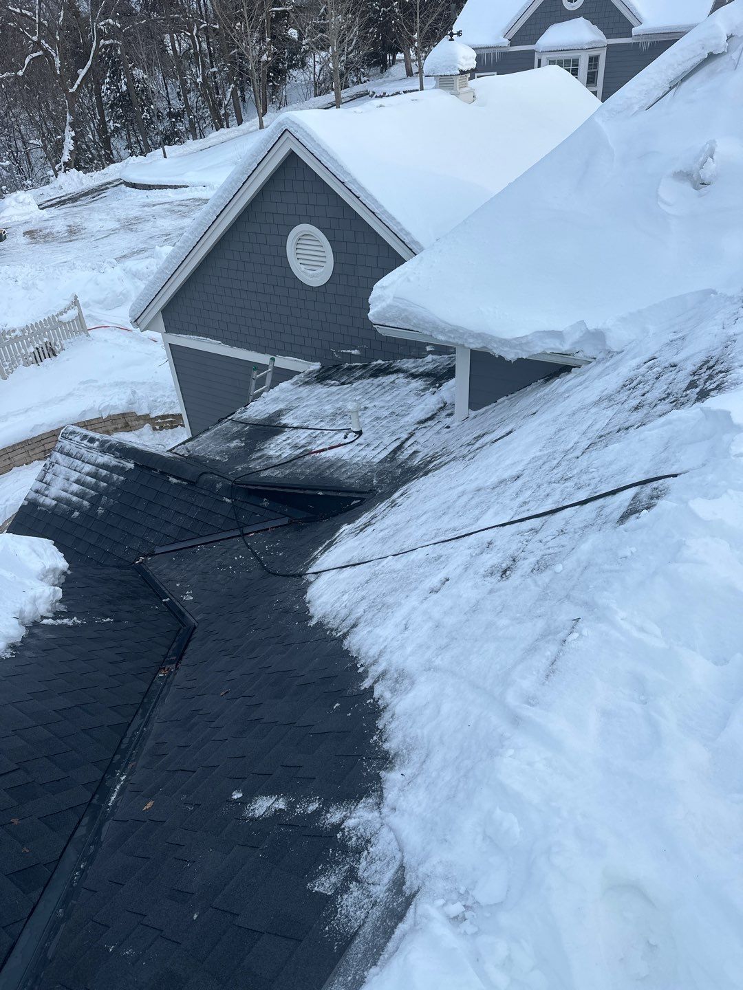 Roof Snow And Ice Dam Removal using Steamer by Total Restoration Services