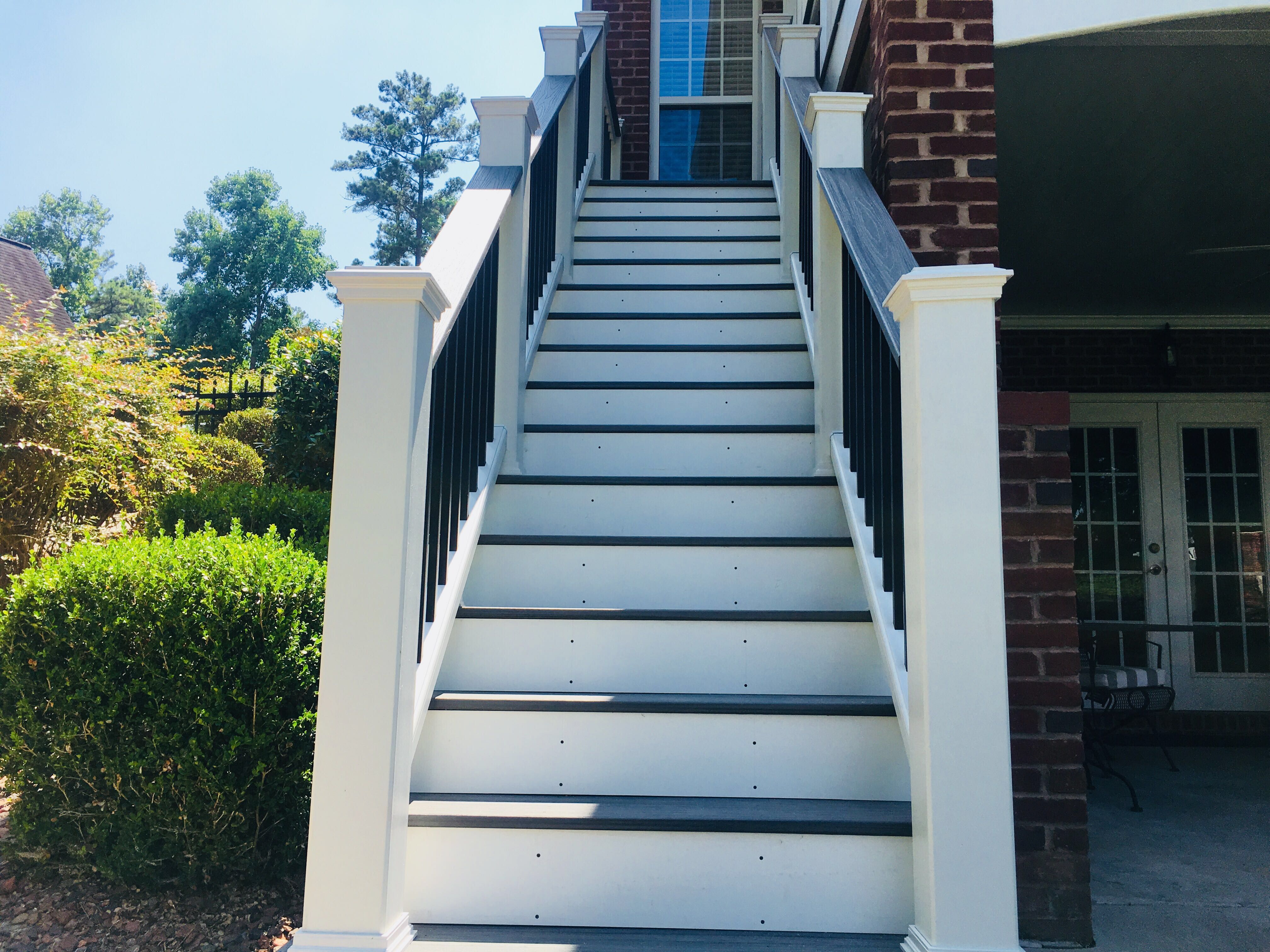 Elevated Composite Deck and Screened Porch Construction in Newnan by Swift Home Renovations