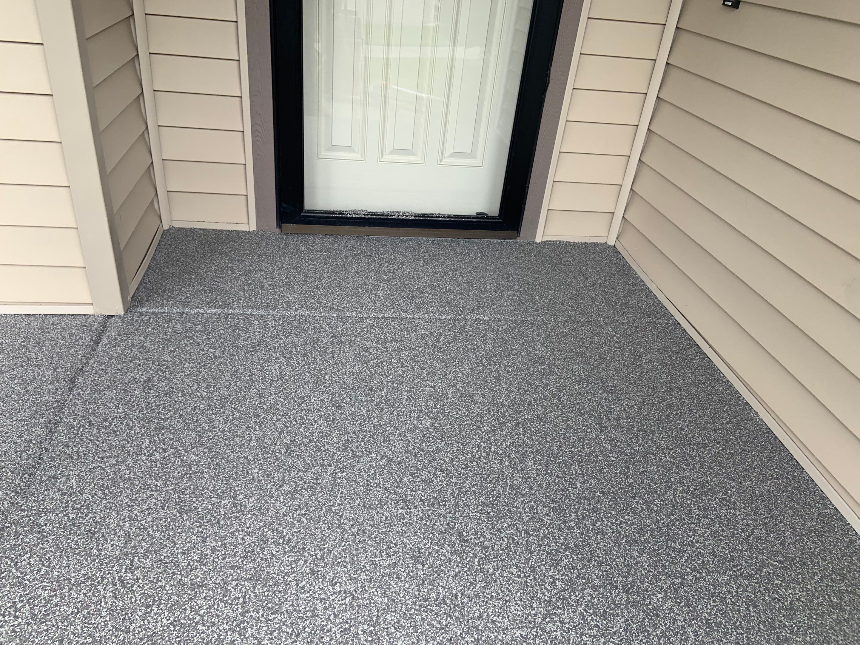 Garage Transformation using Pebble Beach and Front Porch using Greystone by Croc Coatings, LLC