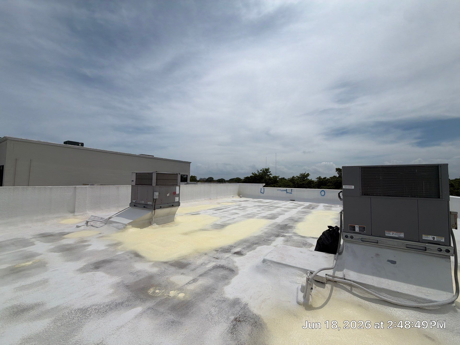 Commercial Flat Roof Restoration and Elastomeric Waterproofing in Delray Beach by Roof King LLC