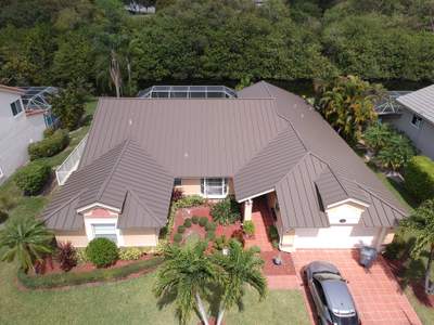 Residential Roofing Installation using 1" Nail strip metal roof
