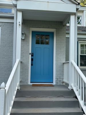 Decatur Exterior Renovation Featuring Painted Brick and Custom Blue Door