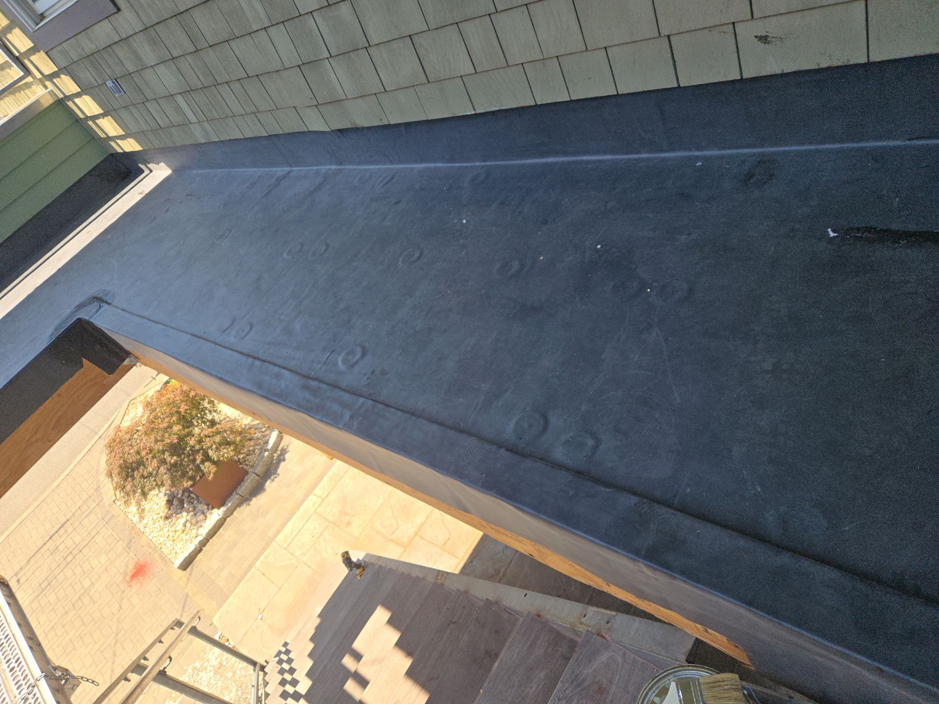 Deck Installation using Tanzite Stone Decking by A Plus Exterior