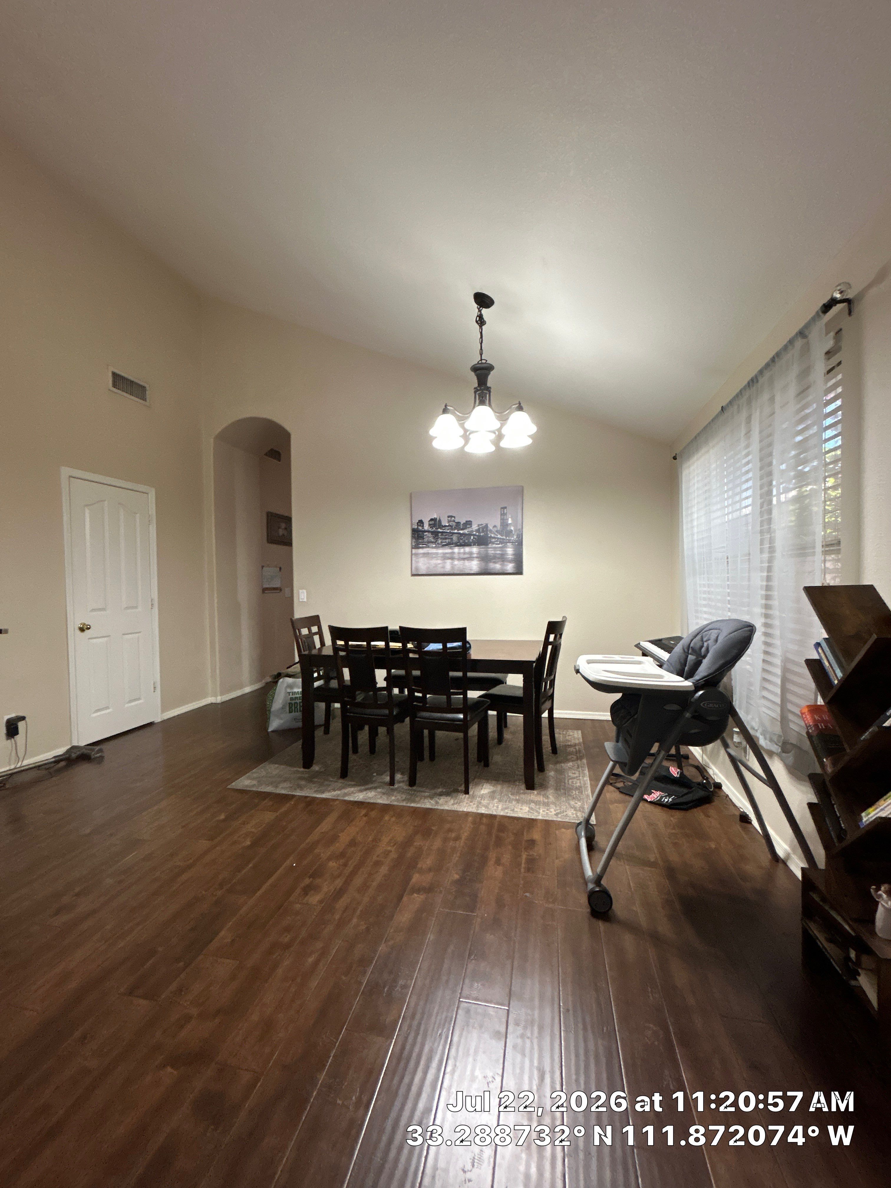 Chandler Dining Room Floor Remodel with Dark Wood-Look Laminate by CompanyCam Sales Demo