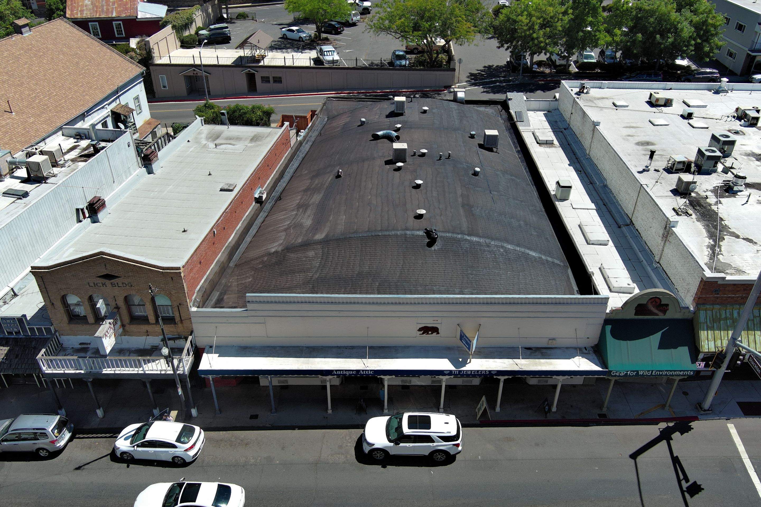 Foam and coatings on commercial roof by Straight Edge Roofing Inc