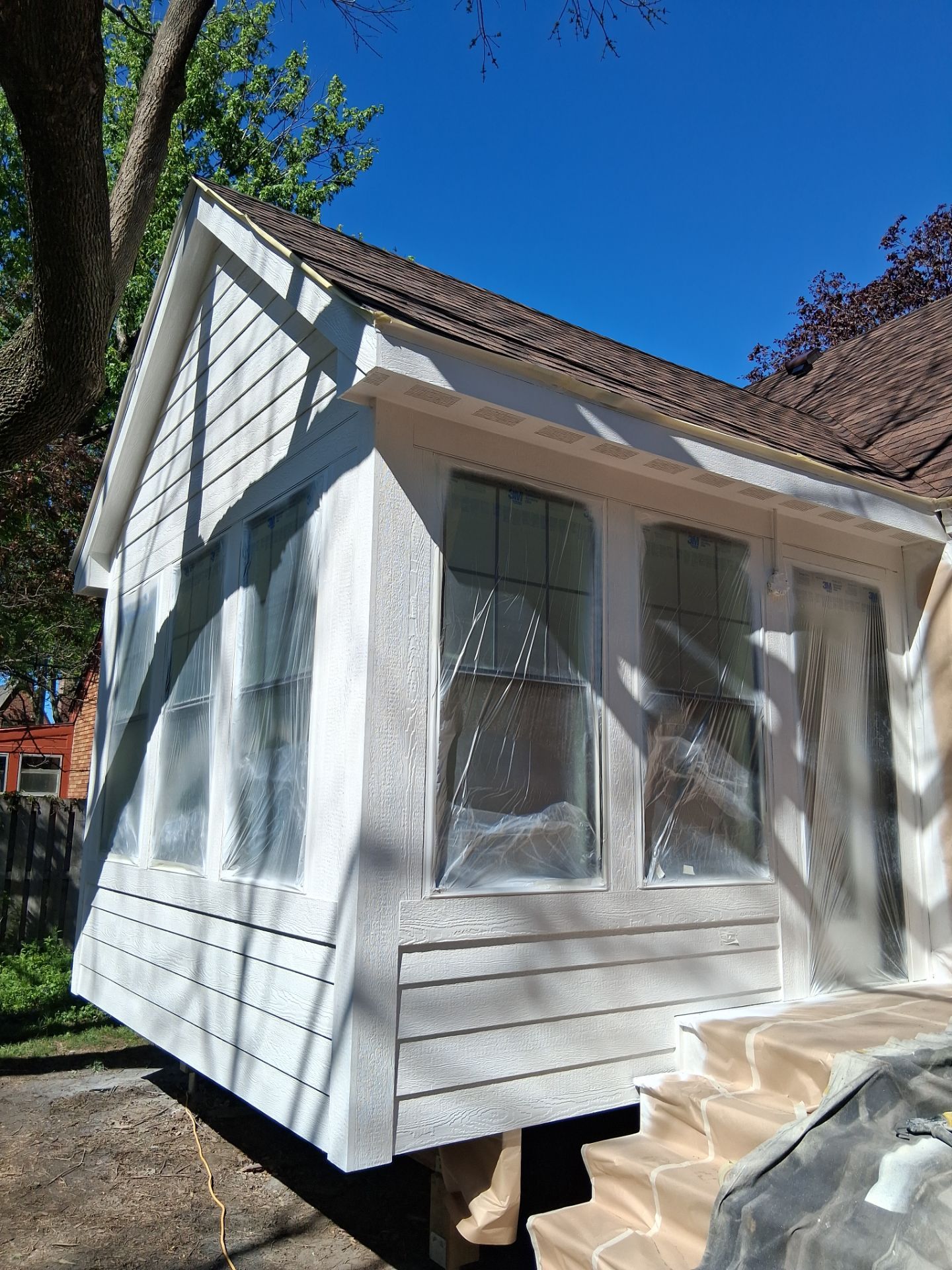 New 4 season room interior & exterior painting by Midwest Paint LLC