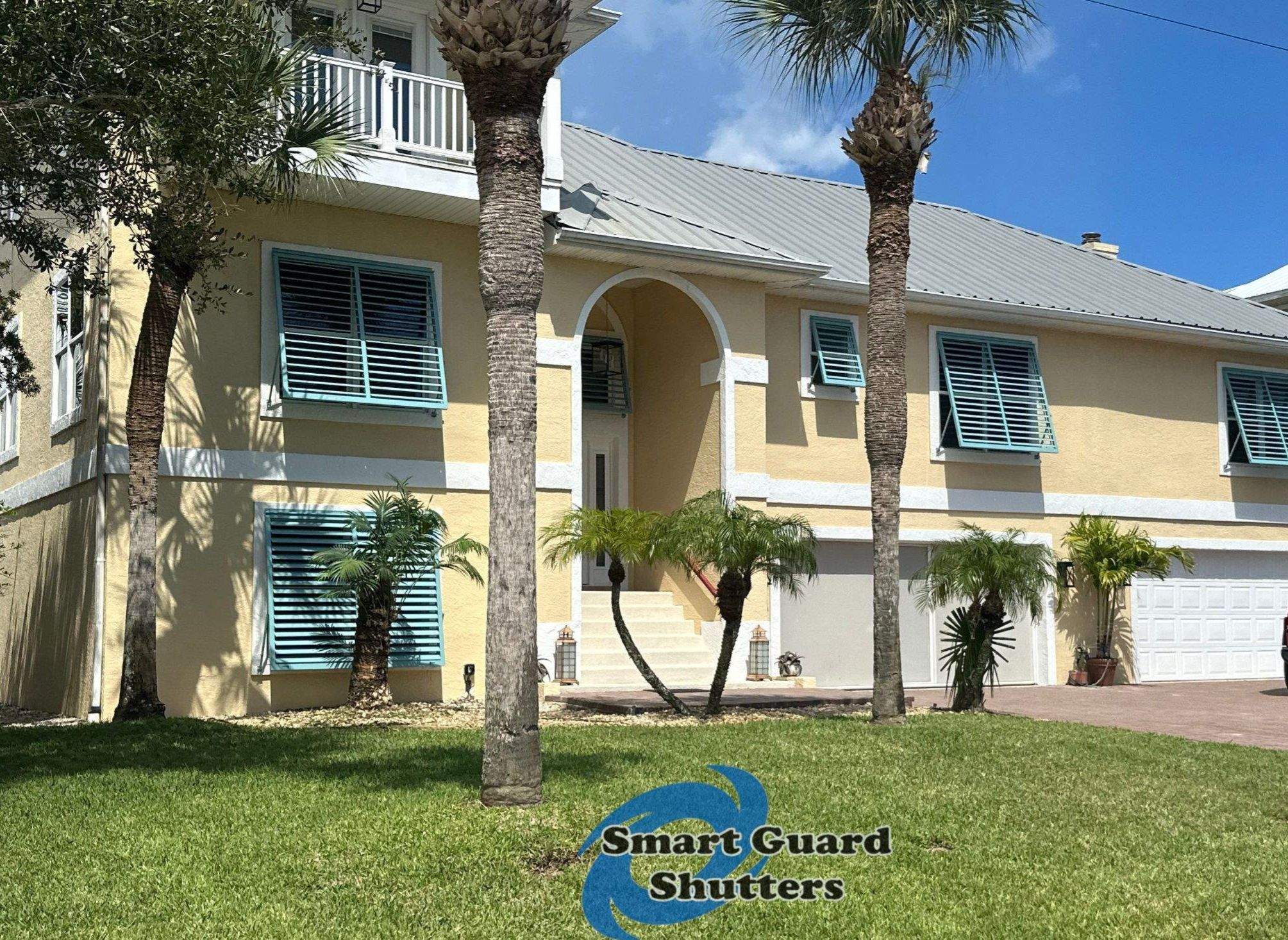 Impact Bahama Shutters in Pastel Turquoise by Smart Guard Shutters