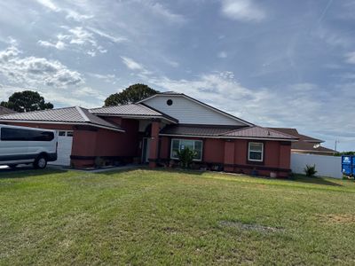 Residential Metal Roofing Installation and Gutter Replacement in Kissimmee