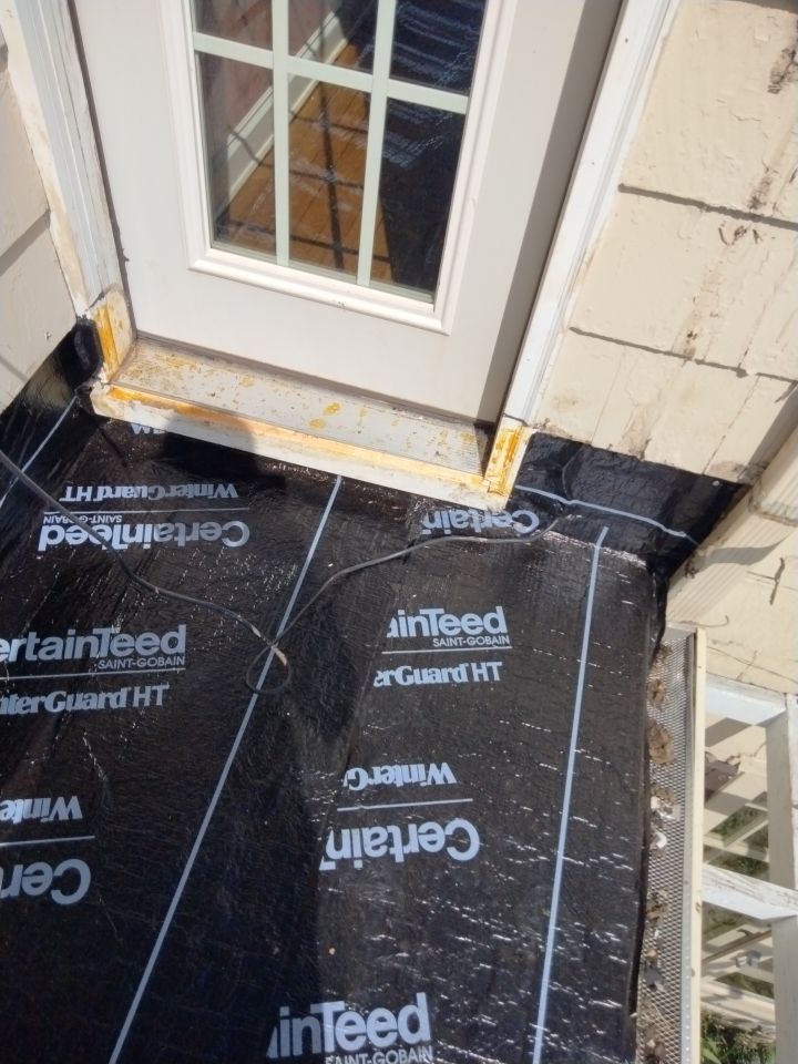 Residential Roofing Installation, Dec-tek walk-out porch roof, siding on garage by Absolute Roofing and Construction