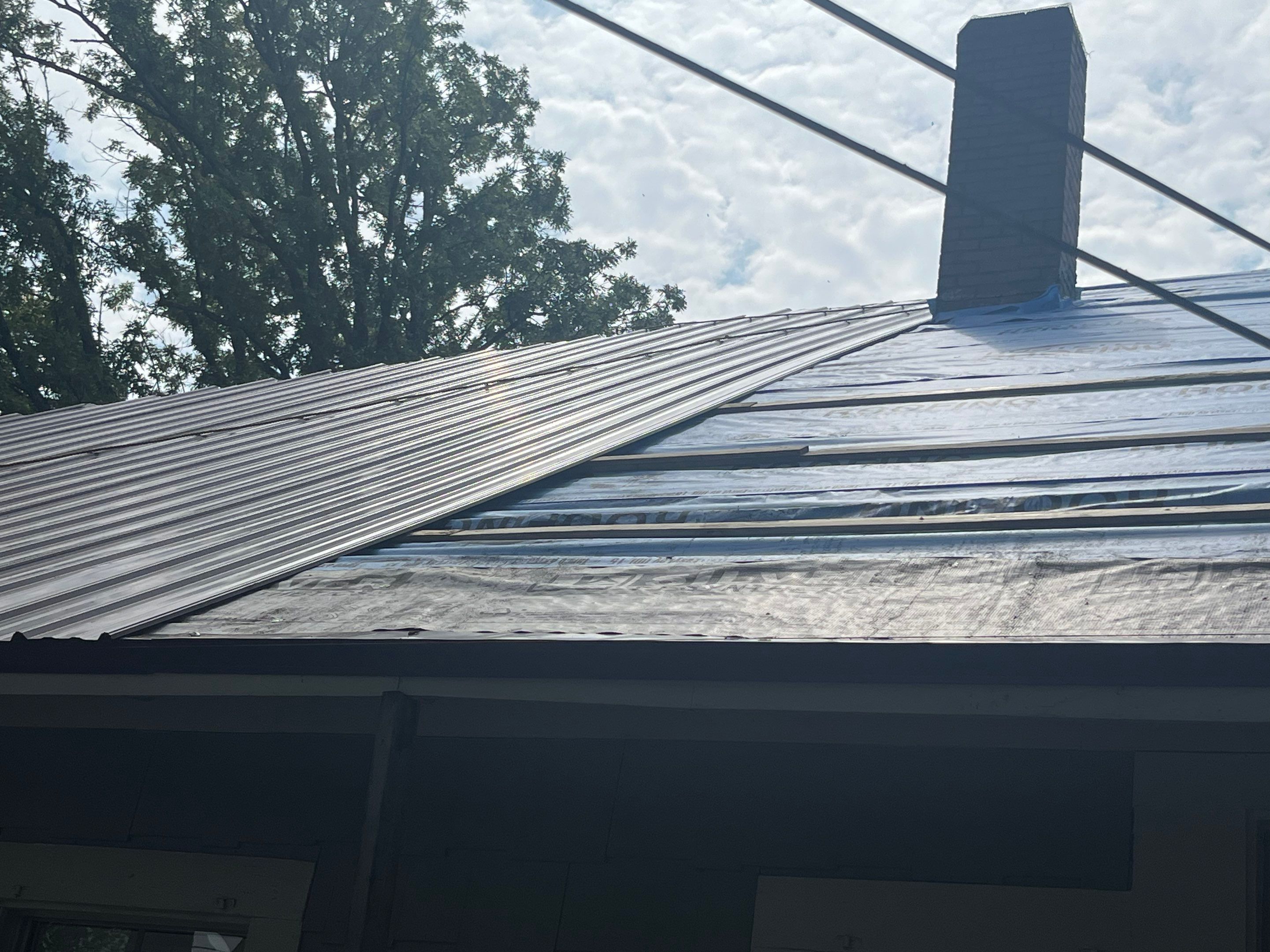 Residential Metal Roof Replacement using Reed's Metals: Colored Residental Panel (Burgundy) by Hostetler Roofing