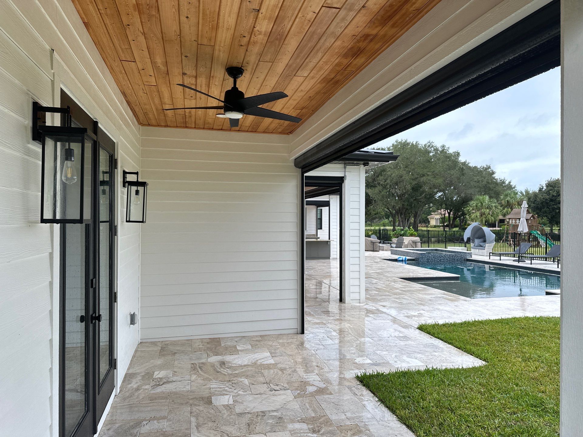 Complete Two-Story House Wash and Driveway Cleaning in Winding River Community, Bradenton, FL by Sunshine AquaWash