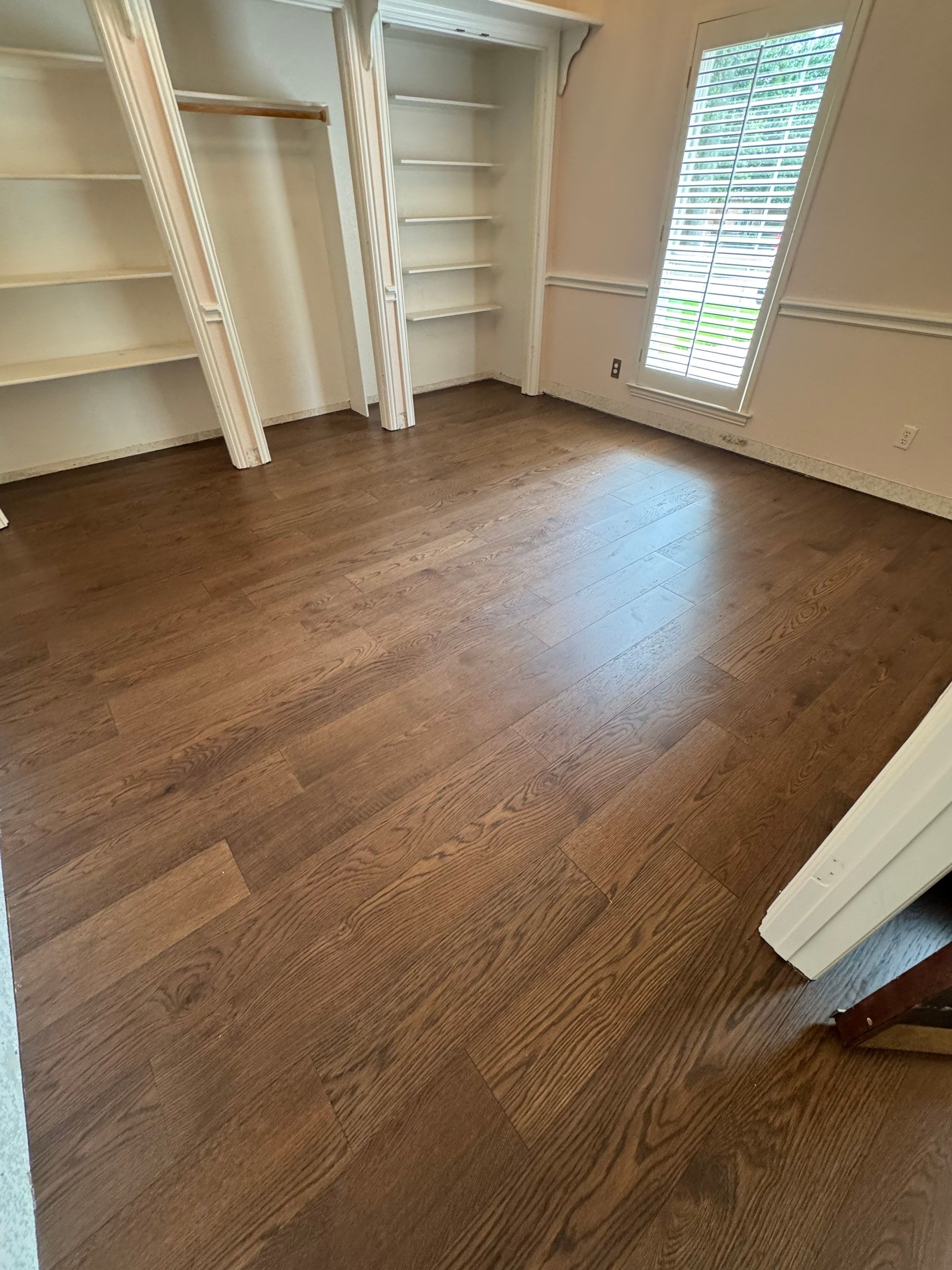 Interior Renovation with Dark Wood Floors and Geometric Fireplace Tile by Simmons Floors