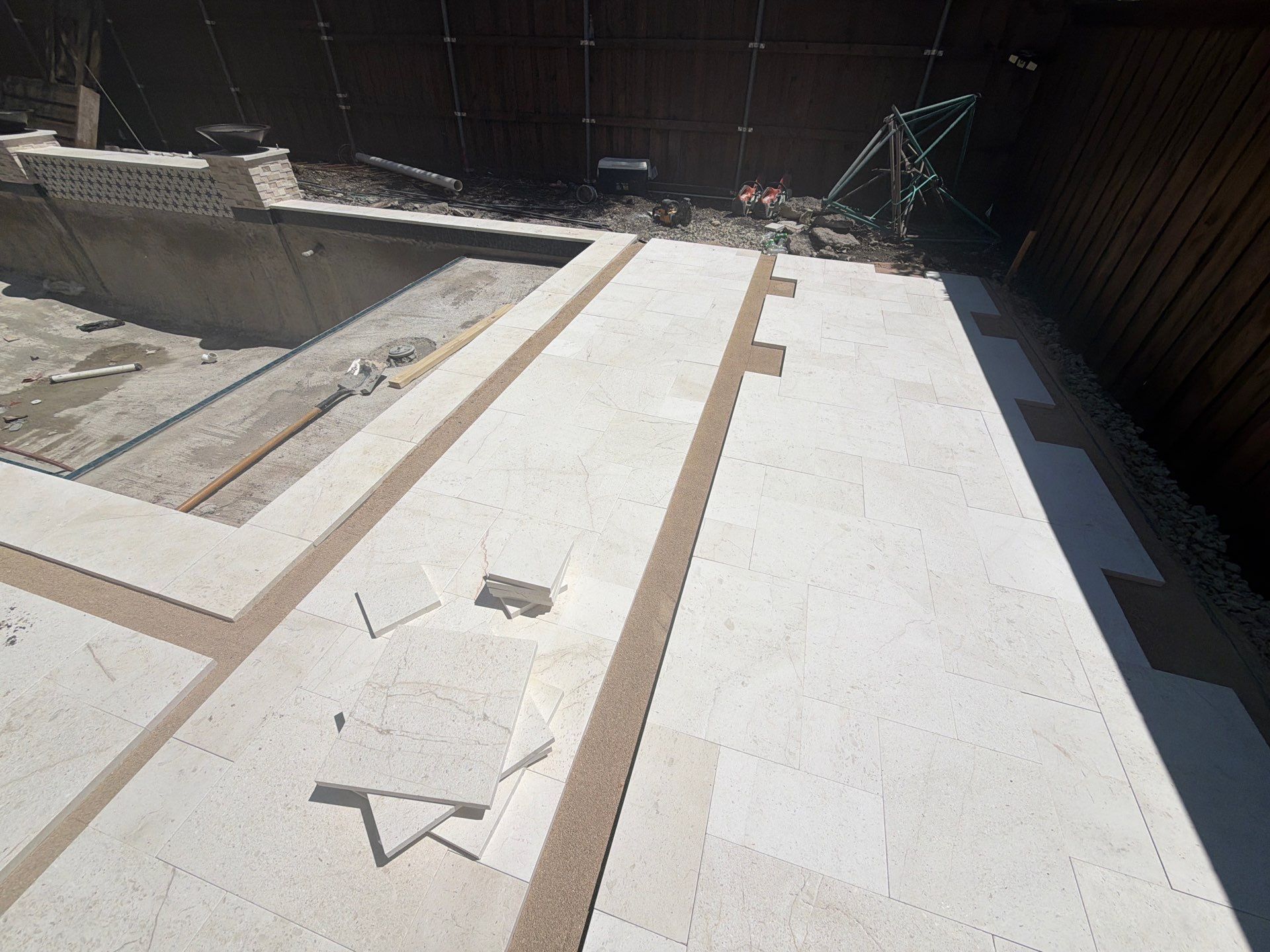 Modern Geometric Pool with Tile Waterfall Wall and Fire Bowls by Pinnacle Pools and Spas - DFW