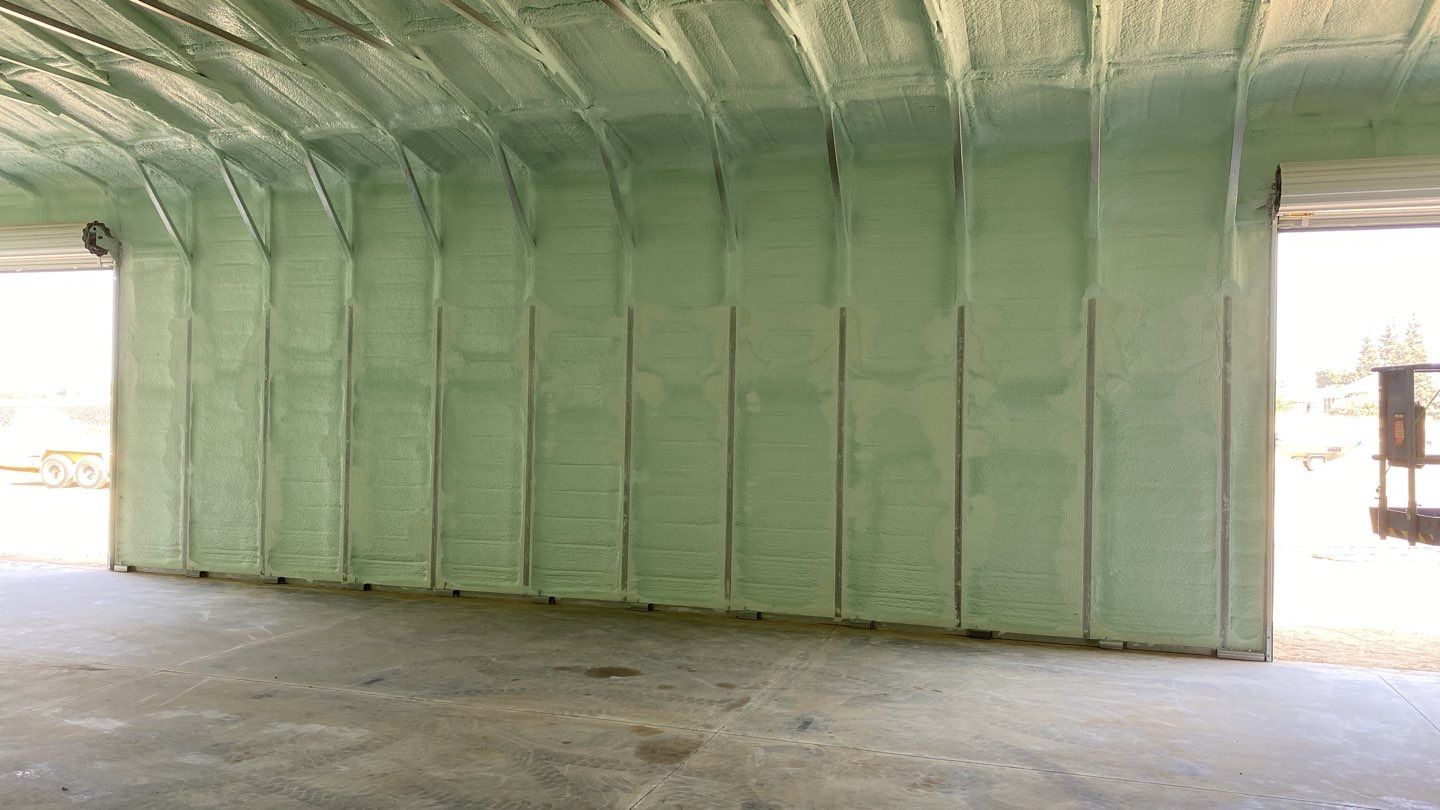 Foam insulation installed in shop by Straight Edge Roofing Inc