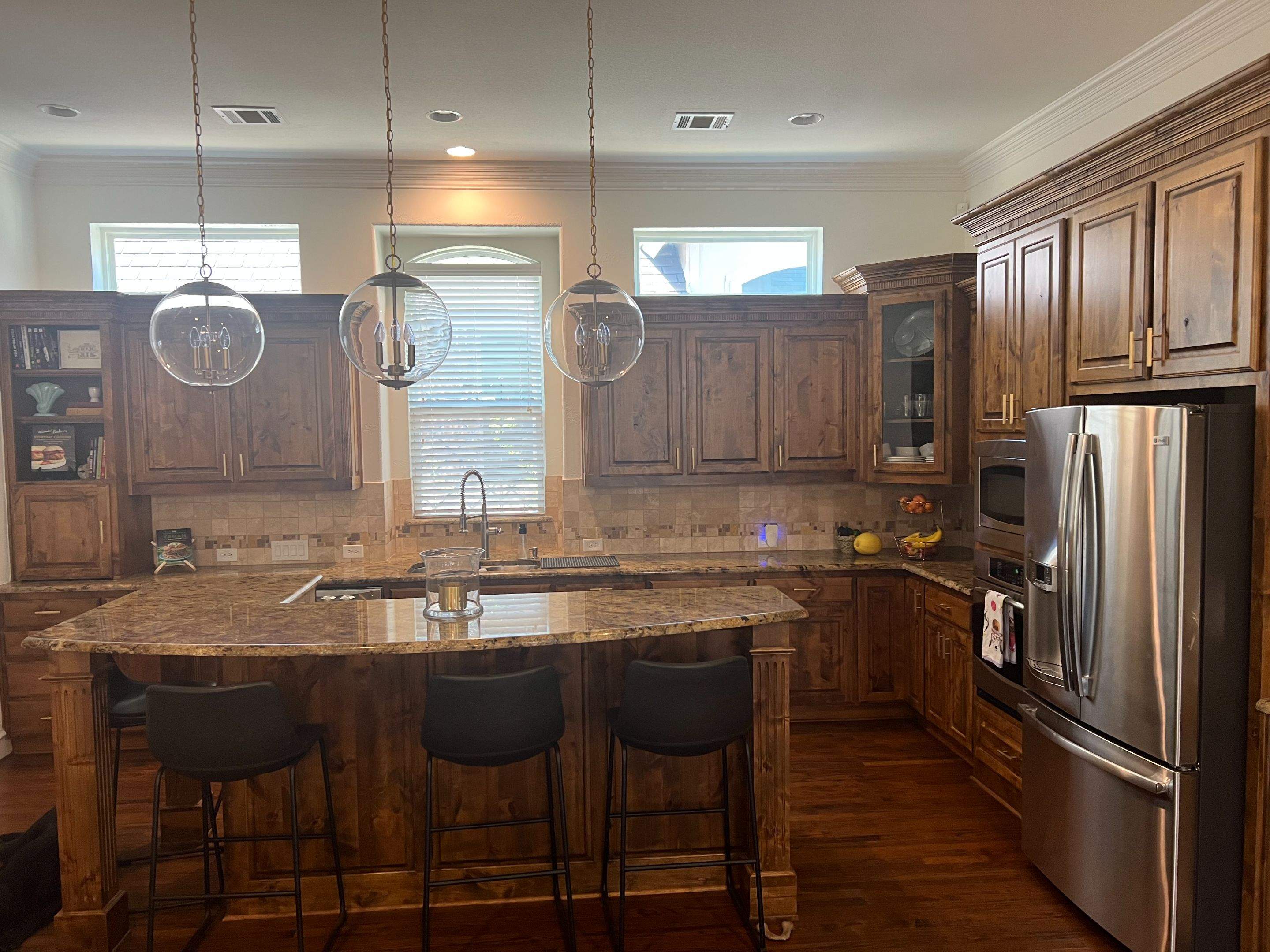 Kitchen Remodel using Quartzite by SLM General Contractors & Roofing