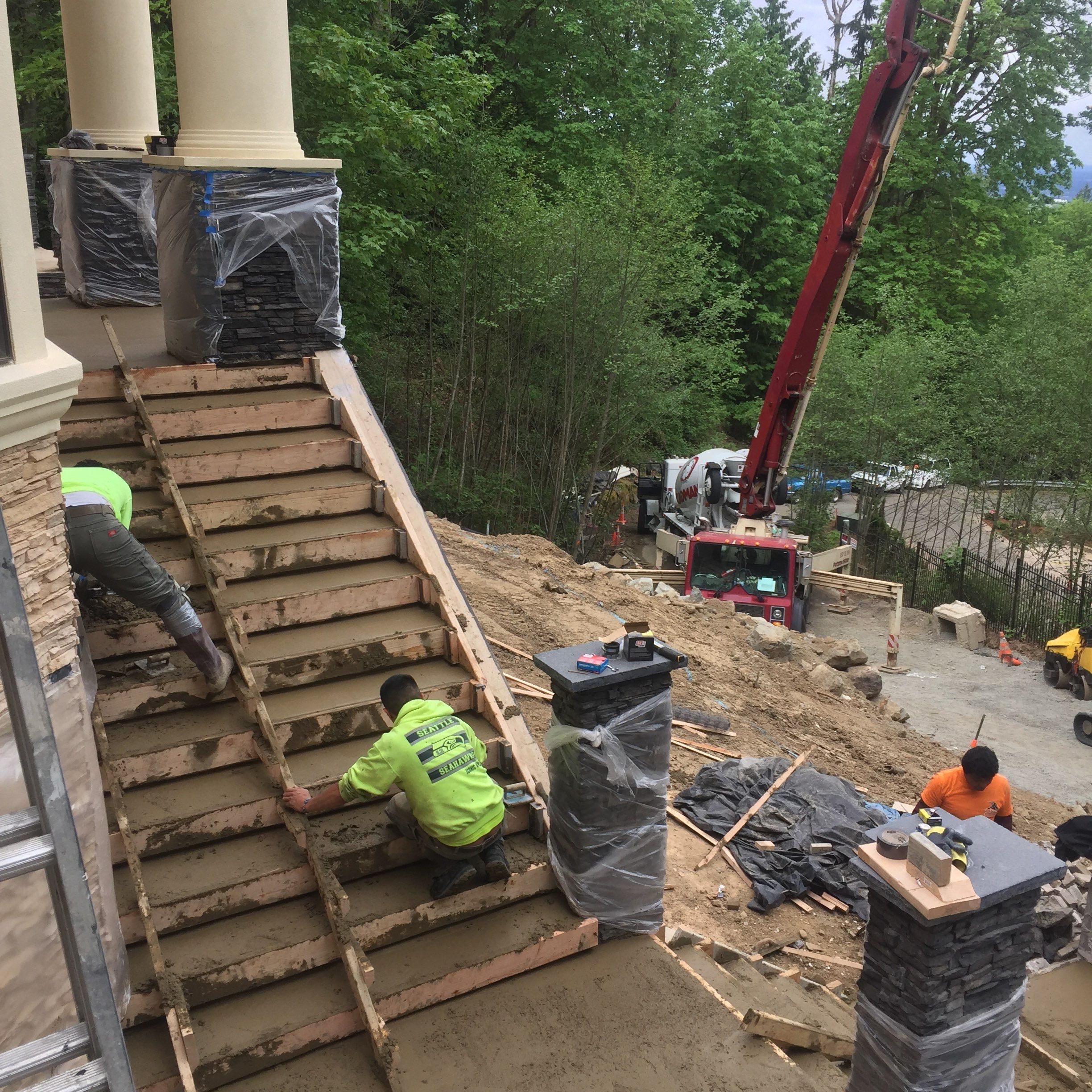 Asphalt Driveway and Stamped Concrete Patio Finish  by Jireh Asphalt & Concrete Inc 