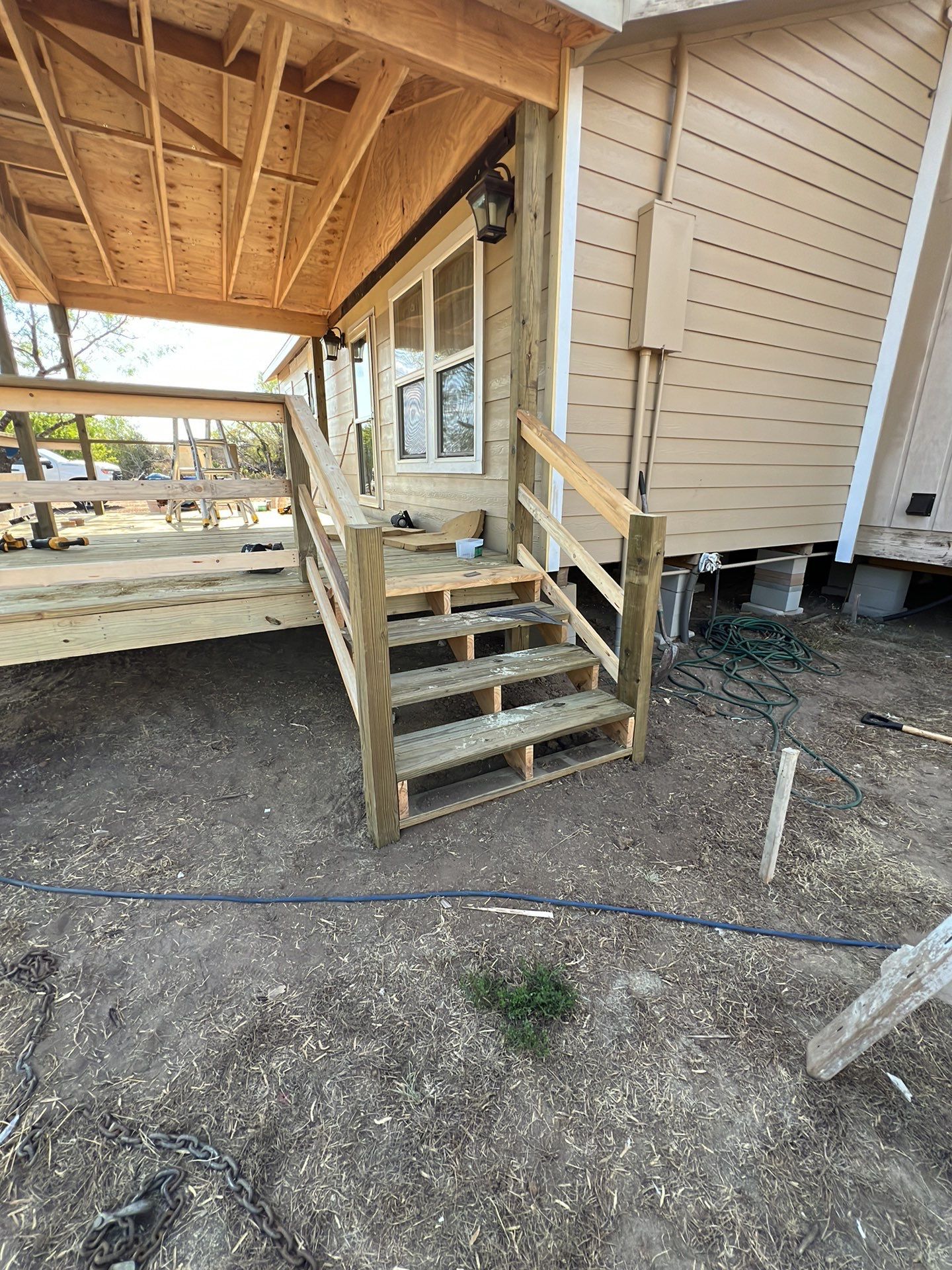 Front Porch Sitt'n by Bayfront Roofing and Construction