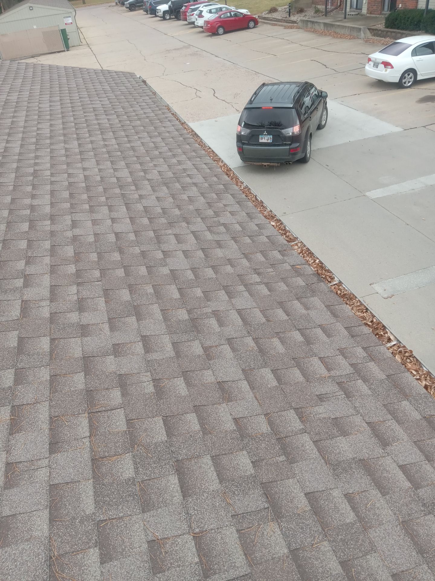 Commercial gutter cleaning South Dakota before photo with filled gutters