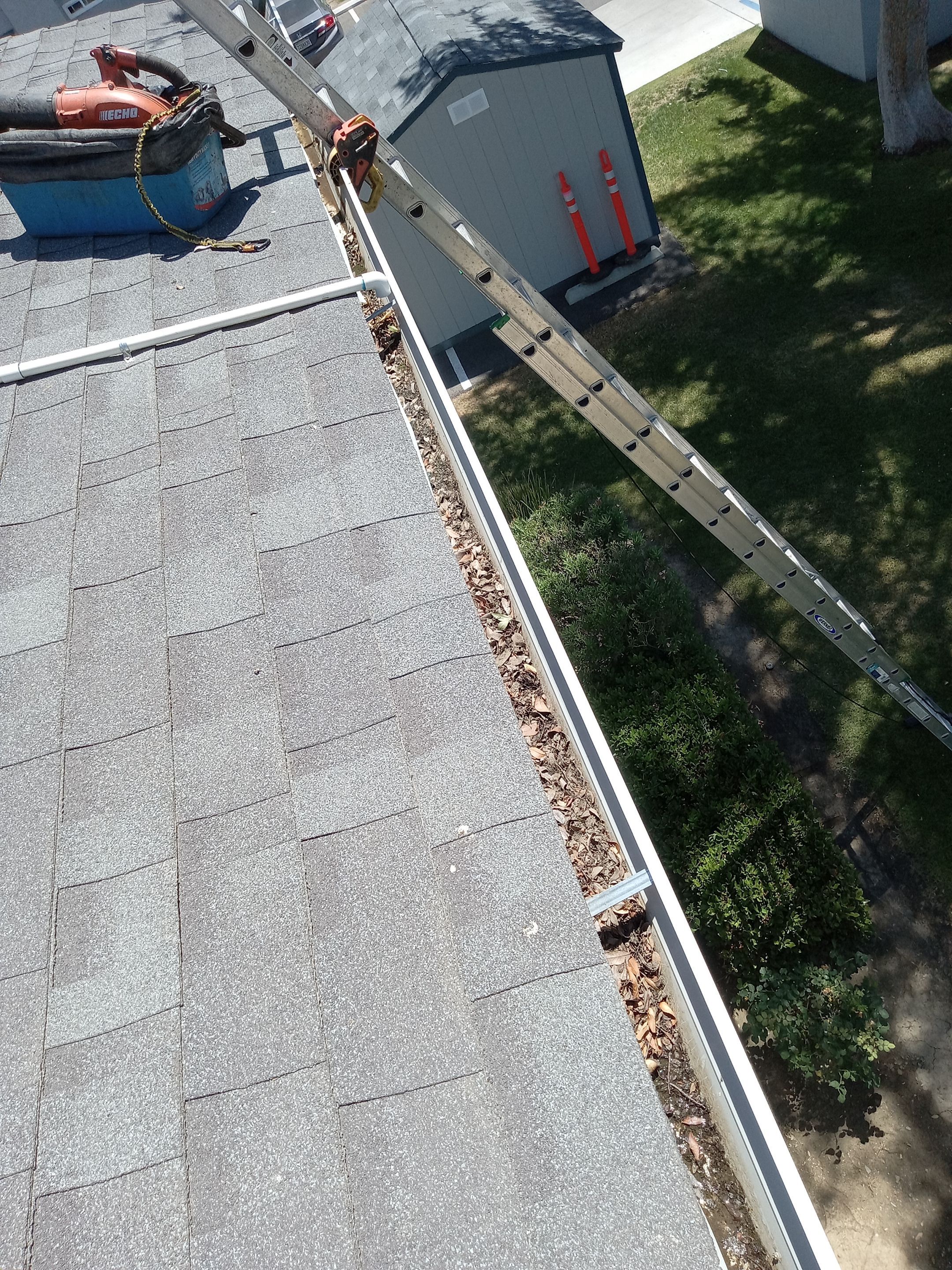 Commercial gutter cleaning Pixley, CA before photo with filled gutters