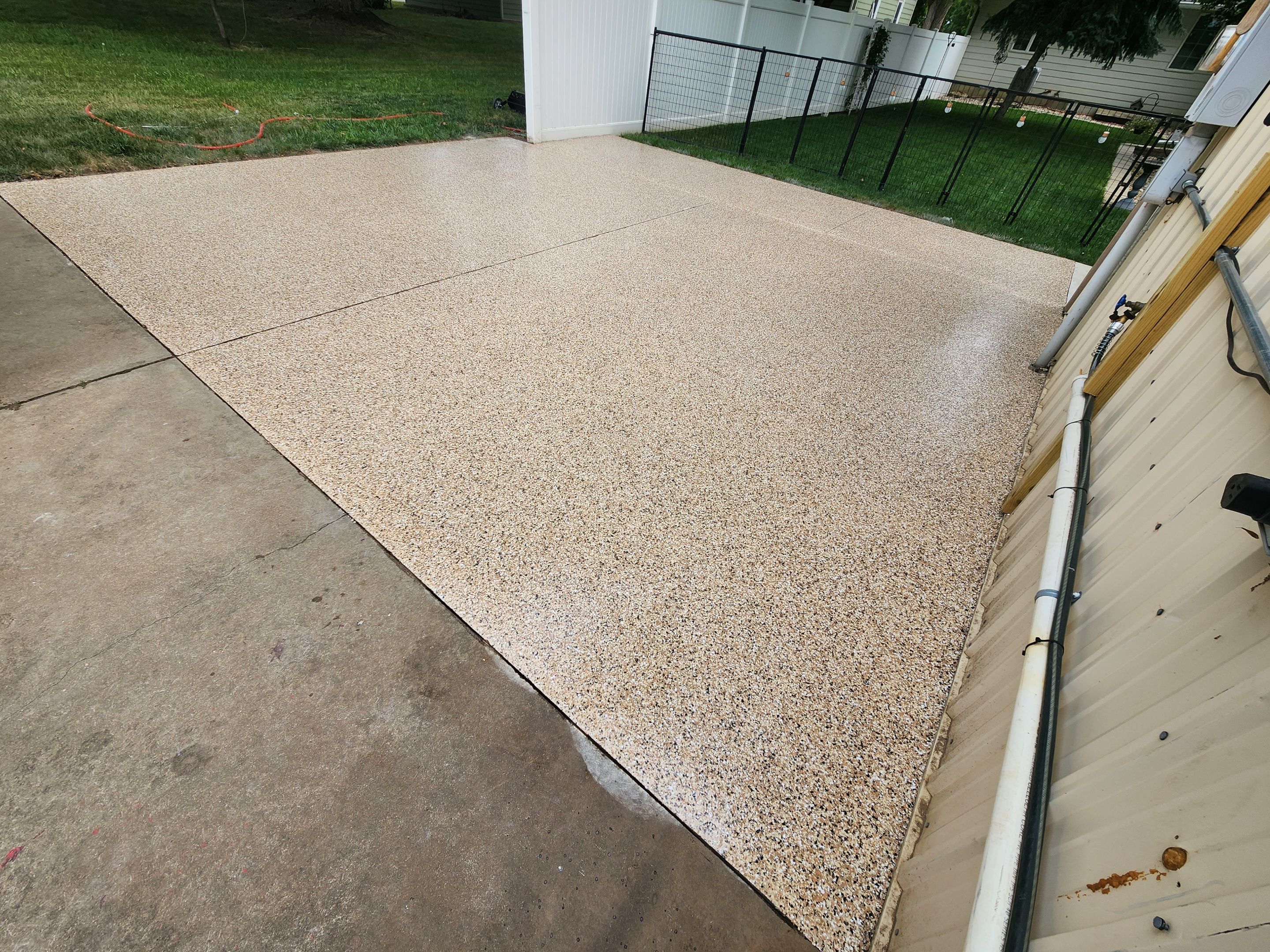 Speckled Epoxy Concrete Patio Coating Installation in Hurley by Select Painting, Coatings & Garage Cabinets