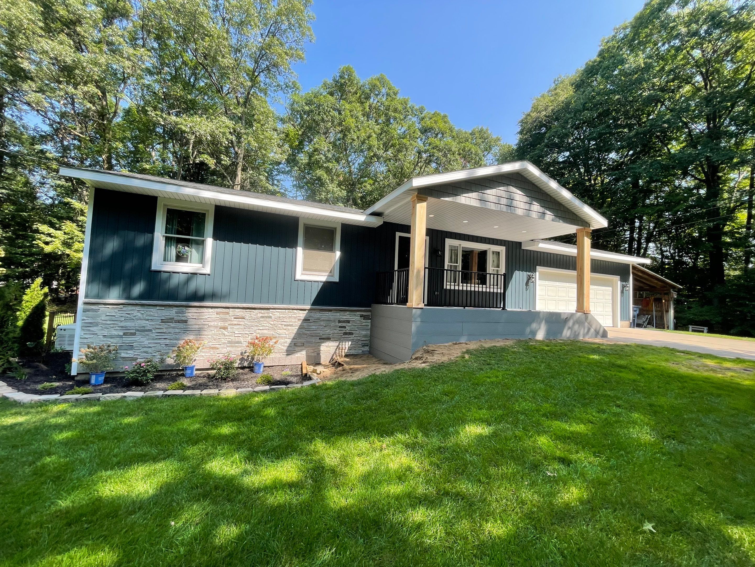 Siding, Deck and Versetta Stone by Avalon Roofing and Exteriors