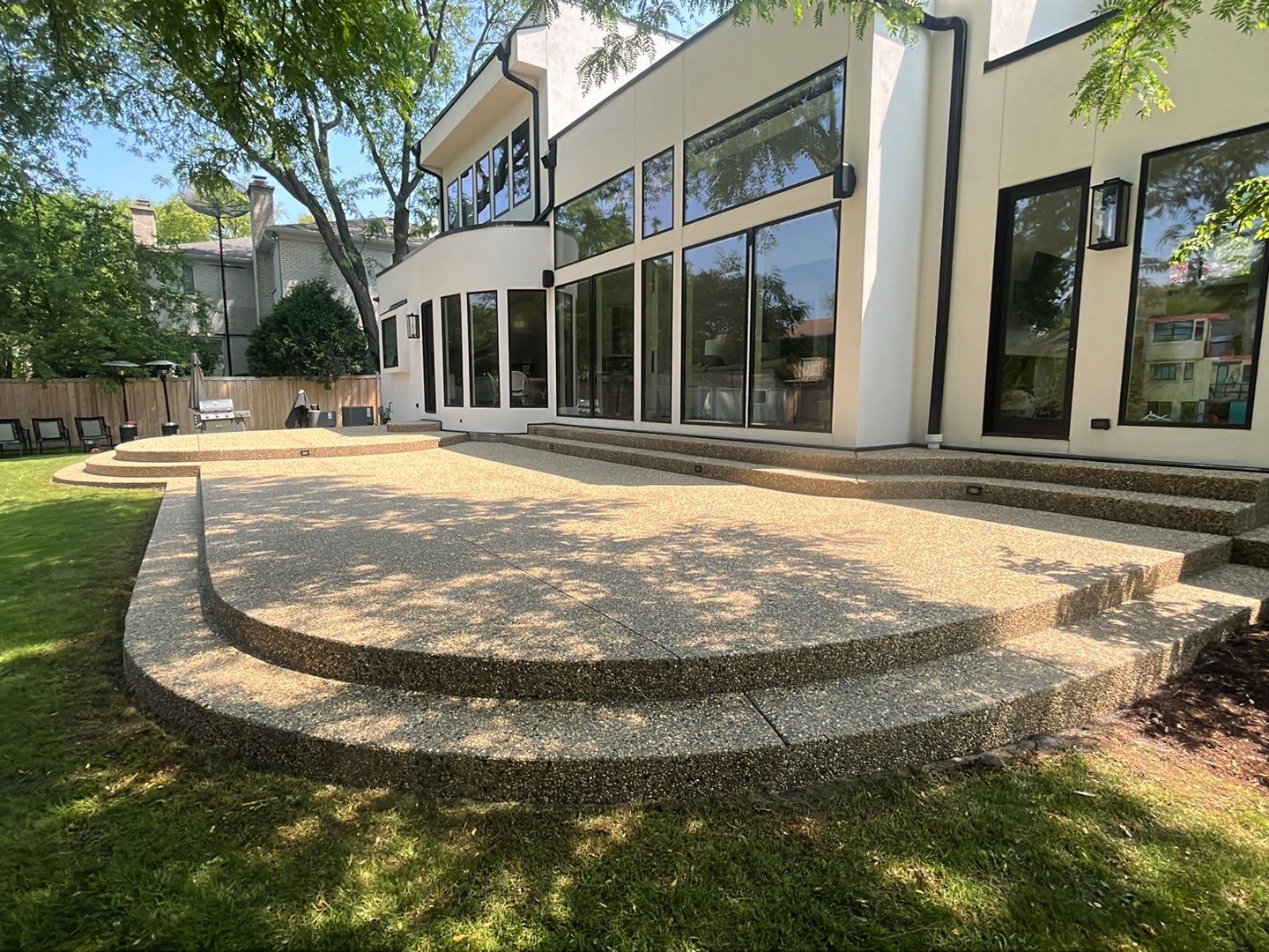 Aggregate concrete cleaning and sealing using Surebond SB-9000 by Northern Power Washing LLC.
