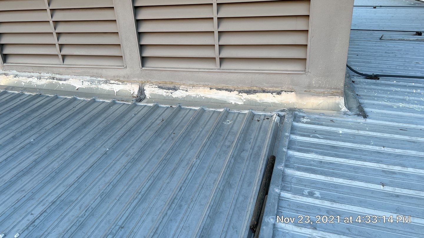 Metal roof restoration on commercial roof using Conklin Benchmark/ PUMA XL acrylic coatings over metal and foam by Straight Edge Roofing Inc