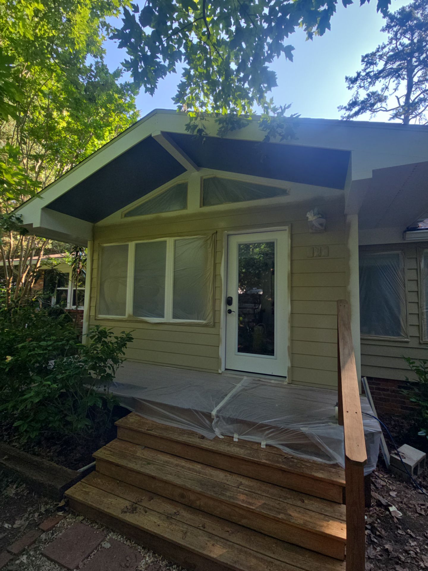 Siding replacement, exterior painting, and front door staining. by GonzalezPainters & Contractors Inc