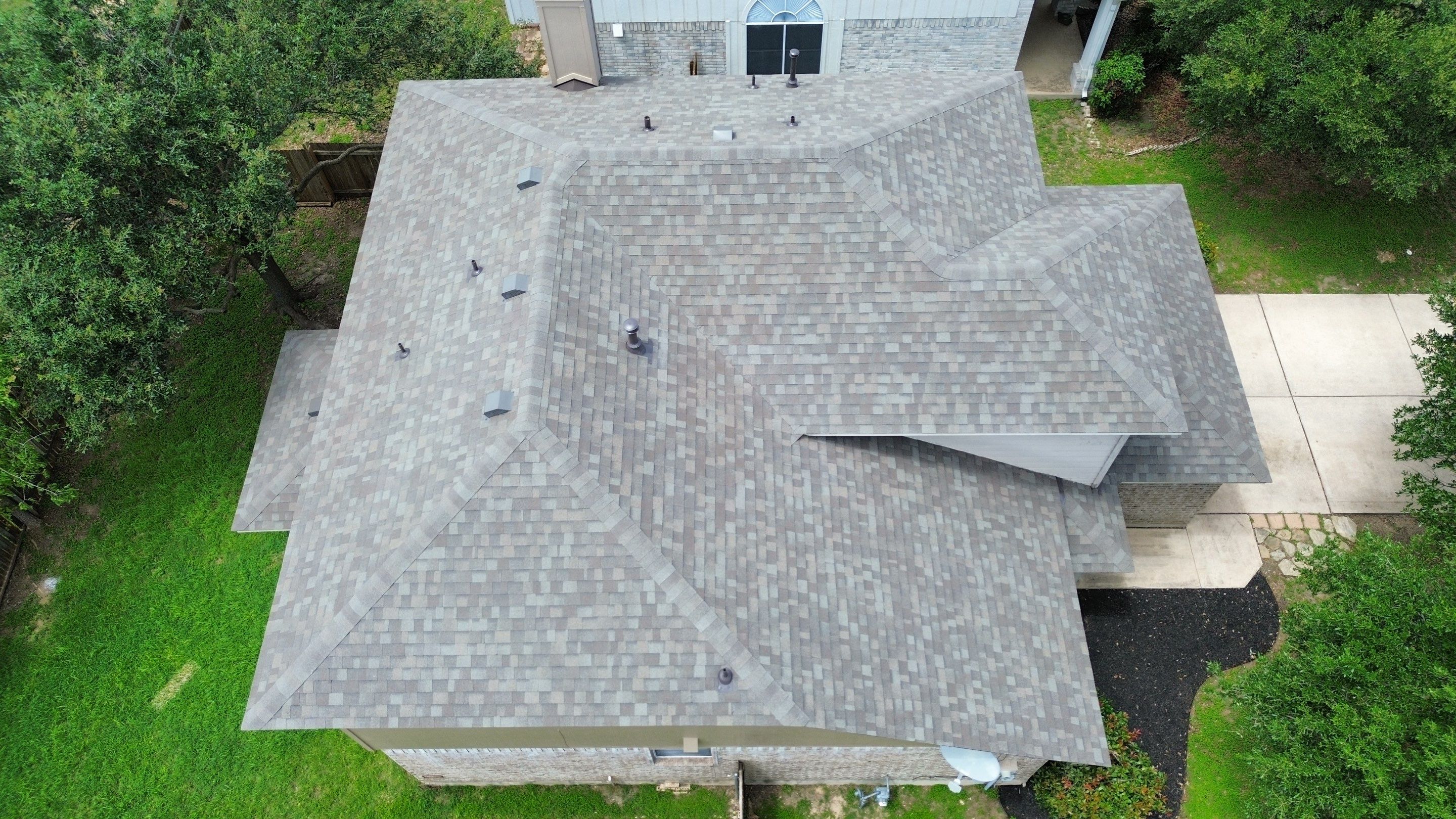 Roof Replacement & Chimney Cricket Upgrade in Cedar Park, TX by Kstylez Roofing & Construction