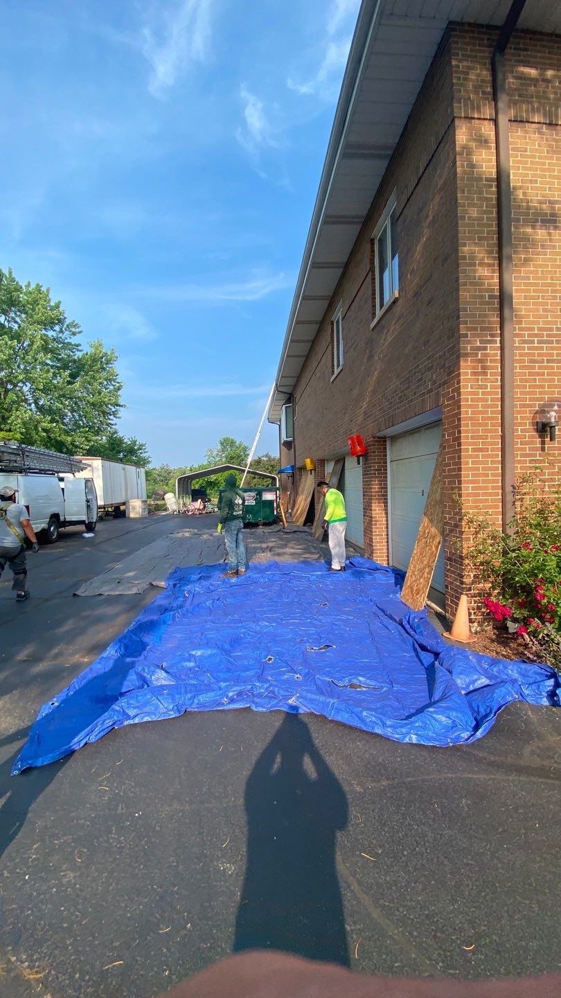 Asphalt Roof Replacement and Aluminum Gutter Installation by Custom Installations