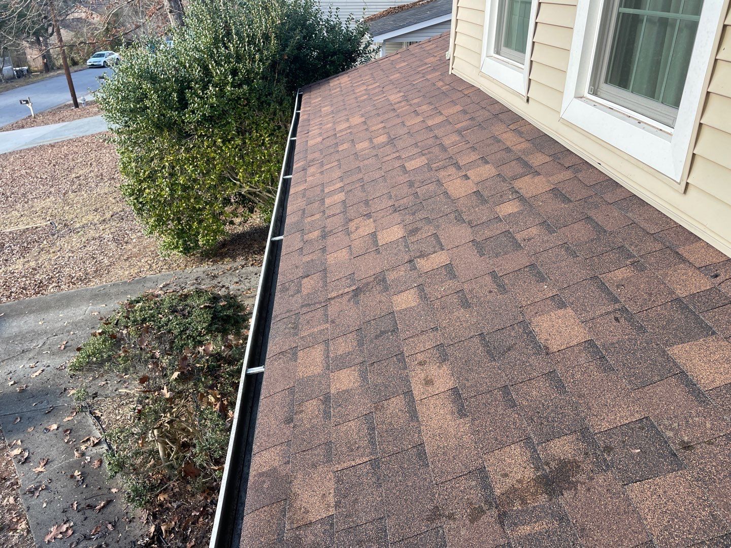 Cleaning Gutters  by Deerfield Roofing LLC