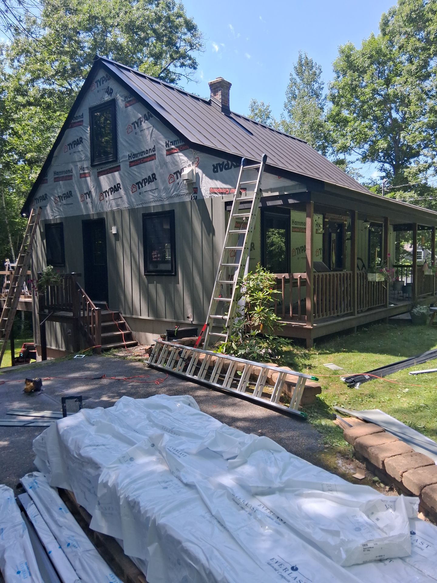 Sage Green Board and Batten Siding and Deck Upgrade in Standish by Tall pine roofing