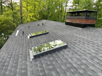 Acorn Deck House Roof Replacement + Skylight Addition