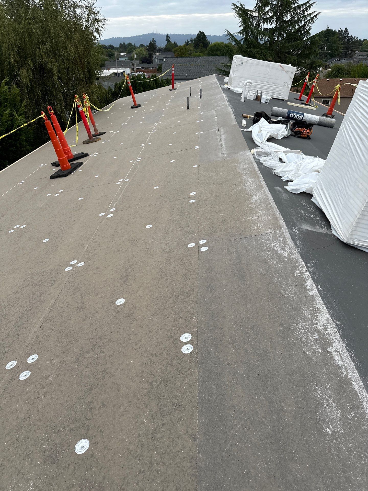 Commercial Flat Roof Installation using GAF 60Mil TPO  by Orezona Building & Roofing Company, Inc.