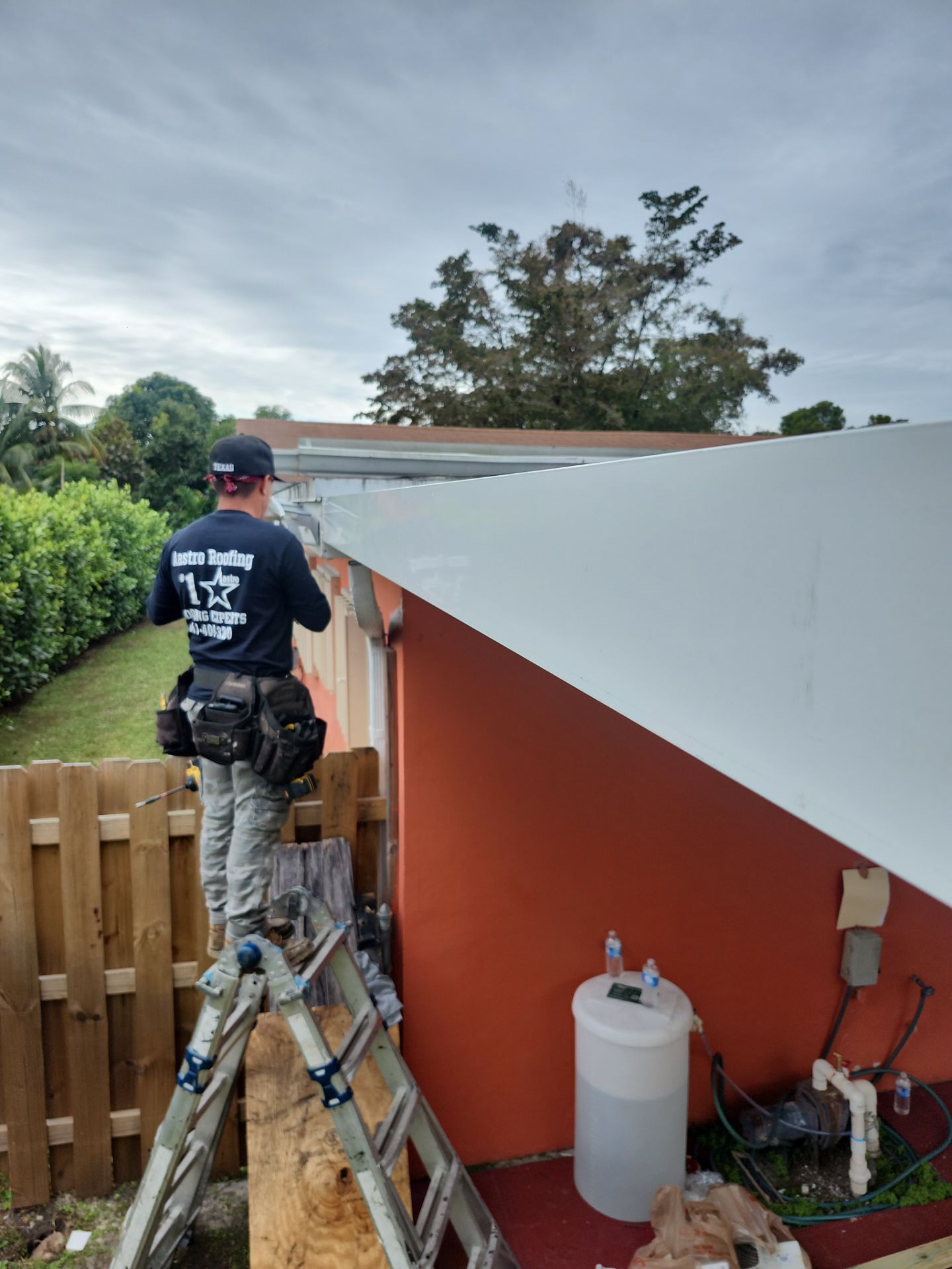 Insulated Screen Enclosure and Wood Tile Deck Installation in Plantation by Aastro Roofing