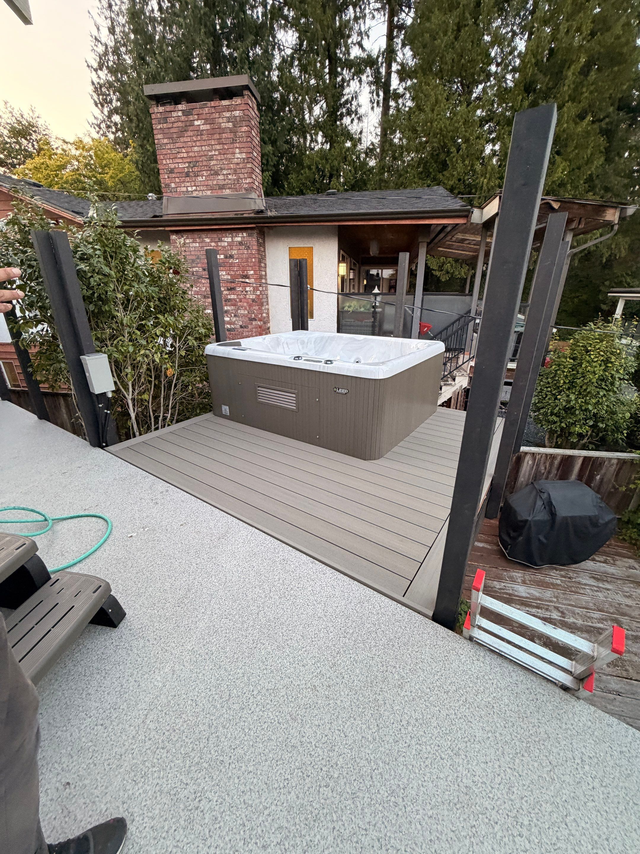 New Composite Deck with glass railing in North Vancouver by YVR Construction Group